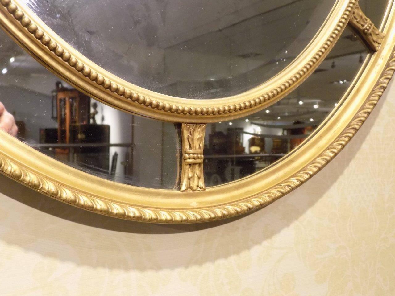 Early 20th Century Gilt George III Style Oval Margin Mirror