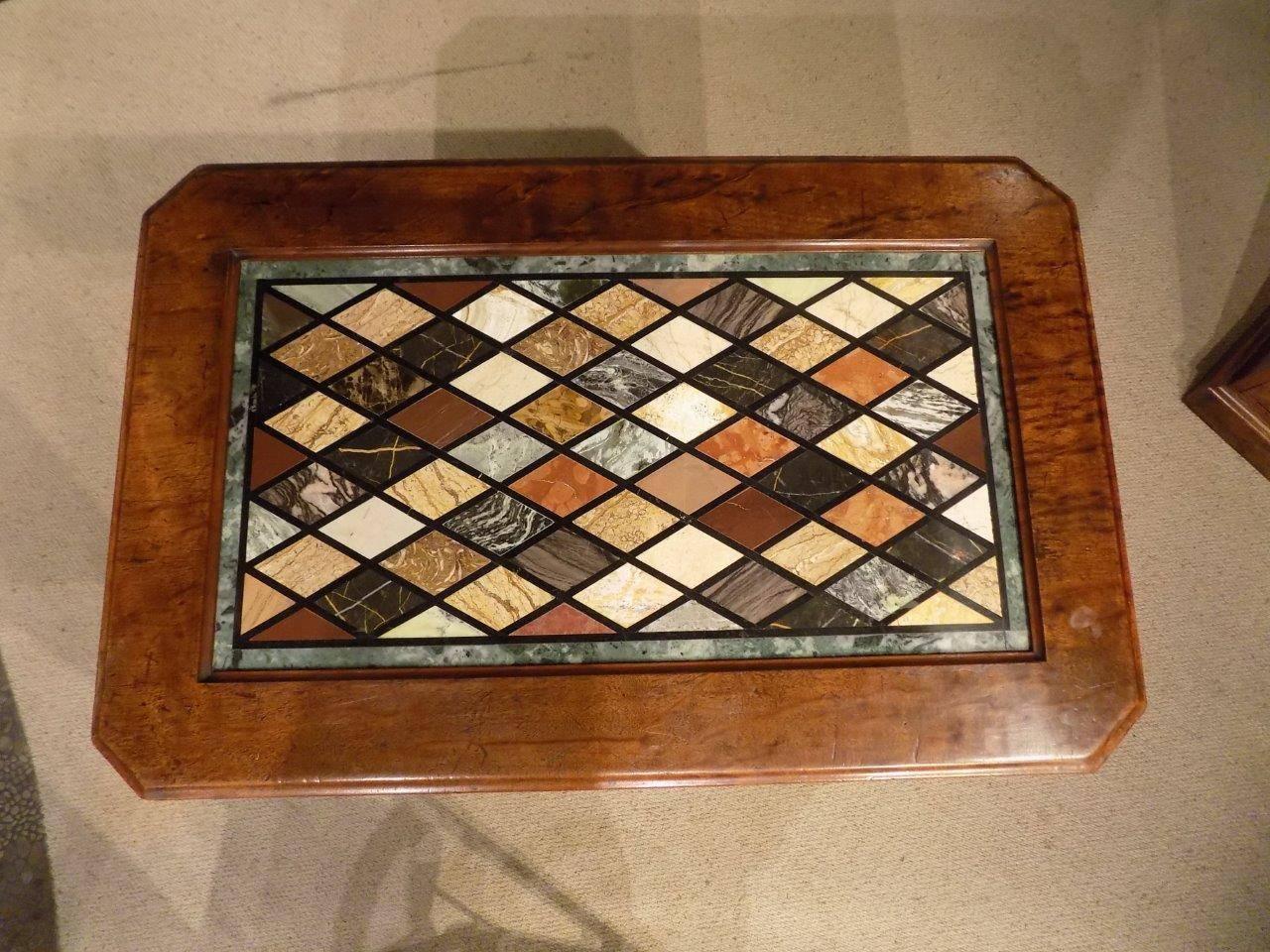 An early Victorian period mahogany Gothic Revival library table with specimen marble top. The rectangular solid mahogany top with canted corners having an inset marble top with a variety of specimen diamond marble insets. Raised on spiral twist
