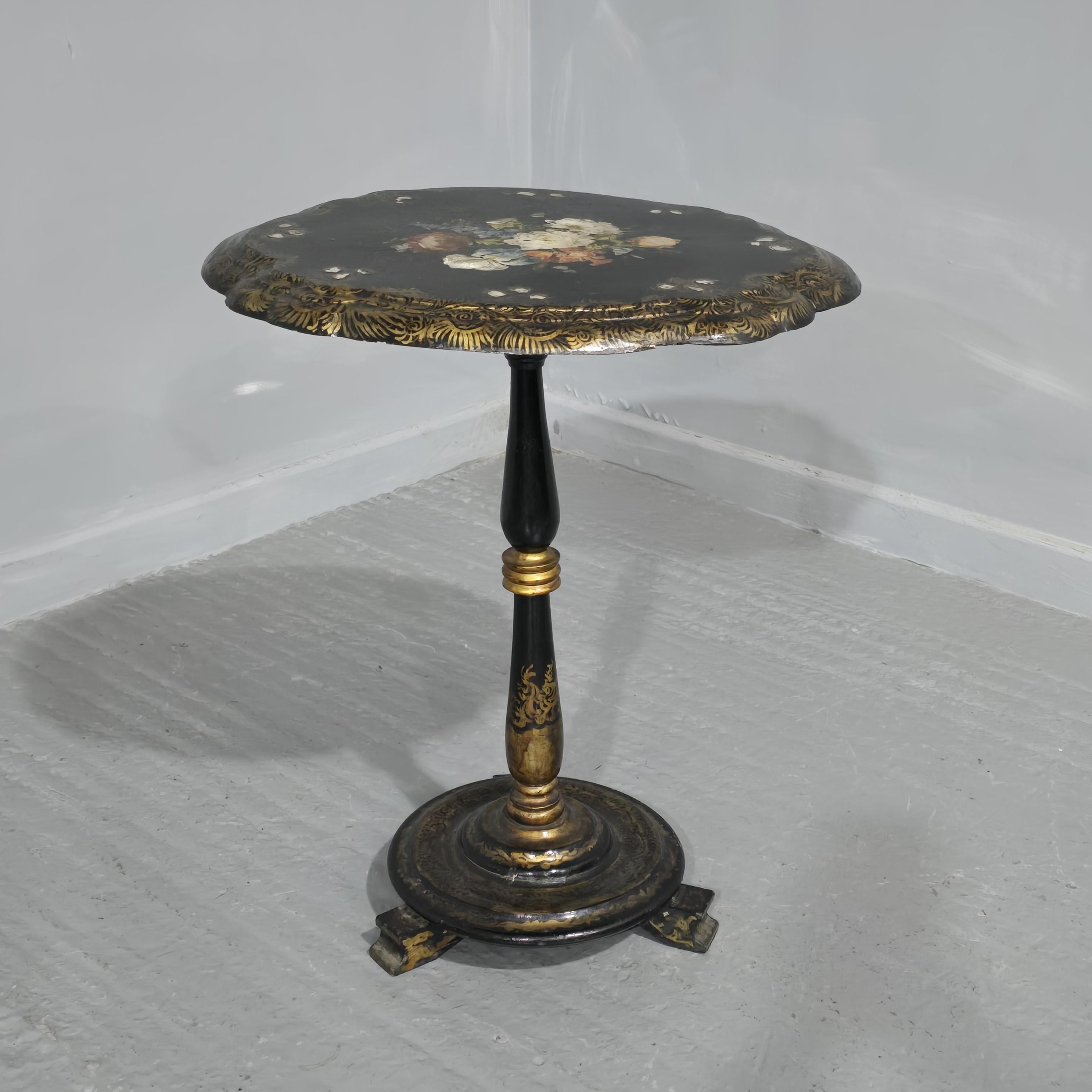 A very nice Victorian papier mache flip top pedestal table,  hand painted with mother of pearl inlay, in very good overall original condition.

27