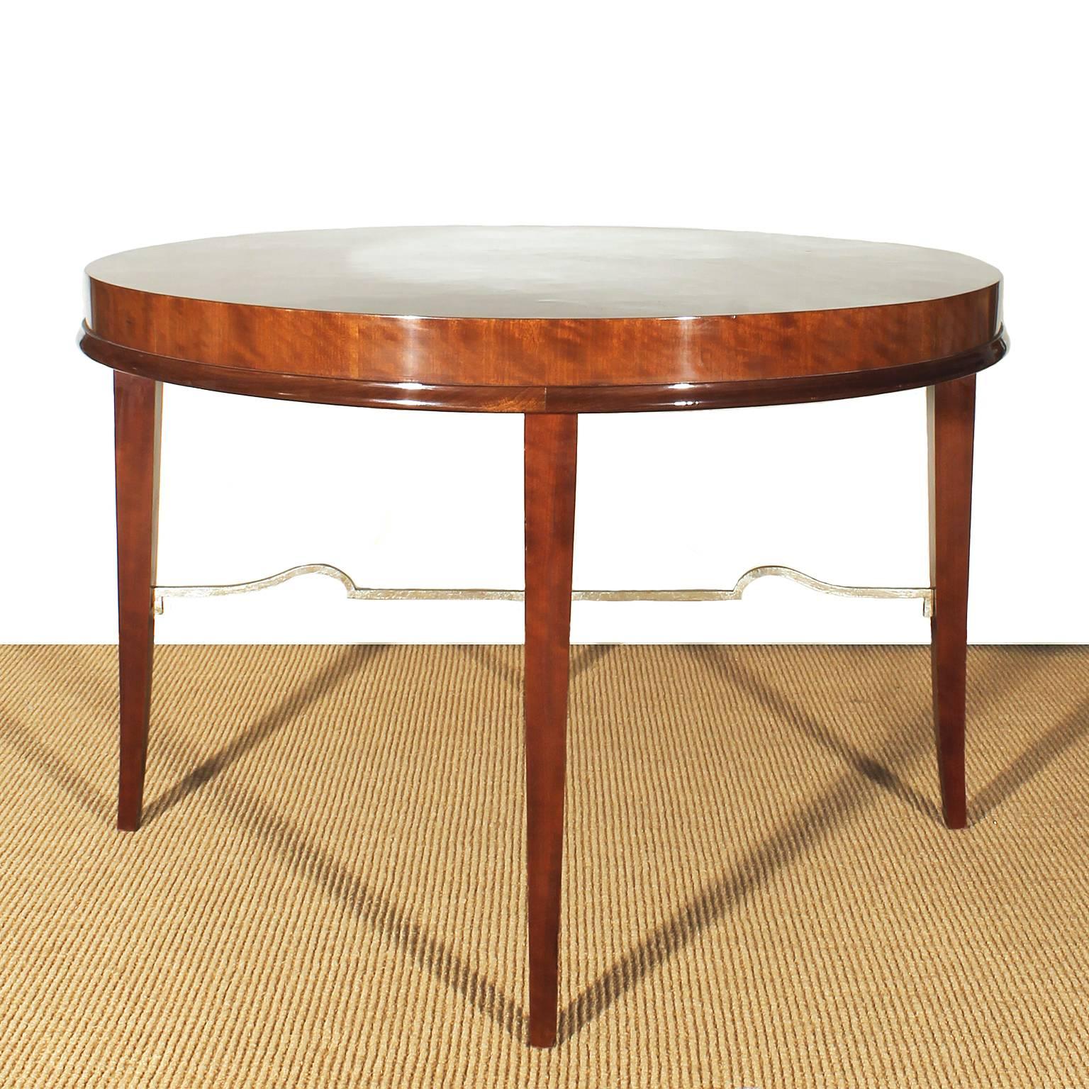 Nice mottled mahogany round sidetable with silver leaves gilded spacer.
Design: De Coene
Belgium c. 1940.