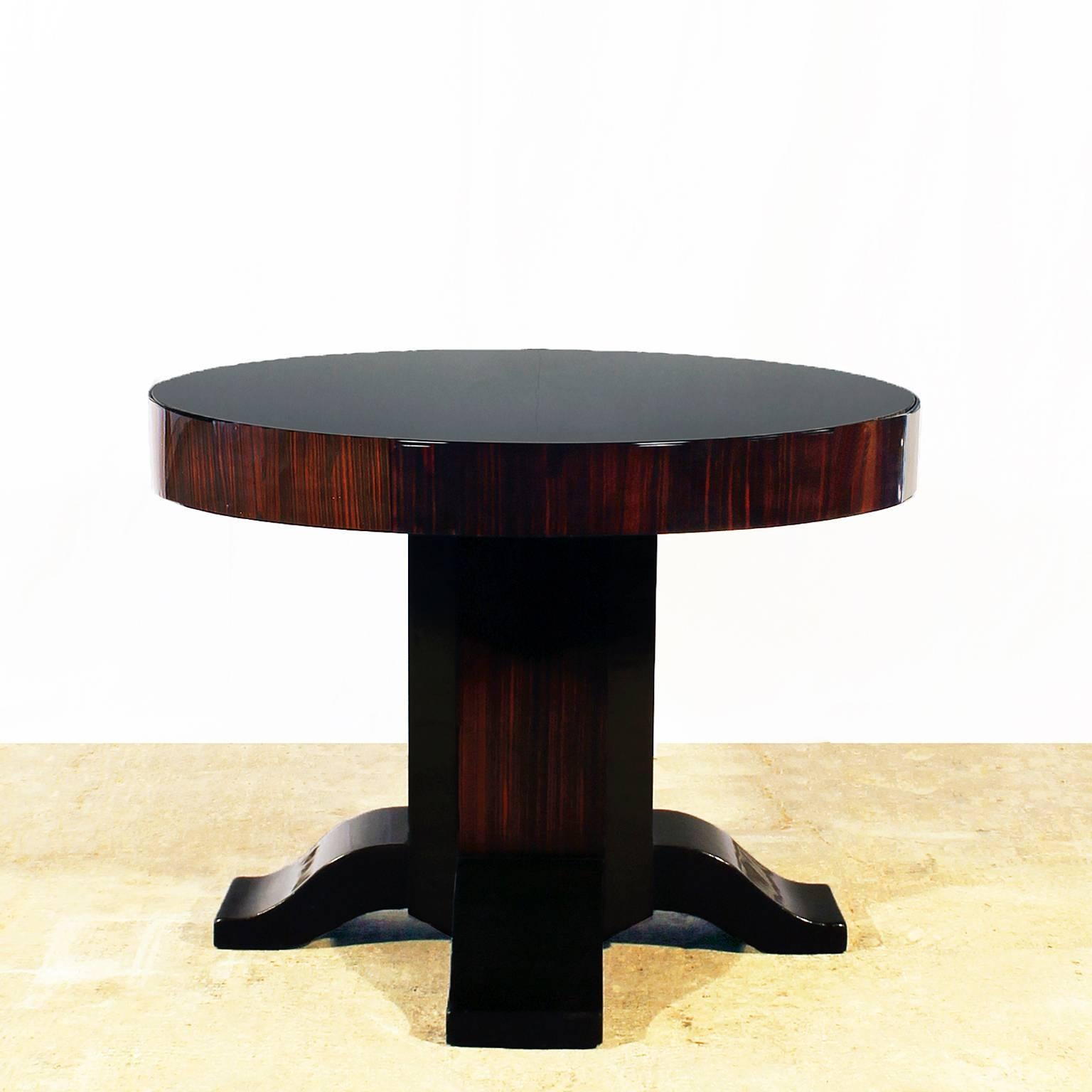 Large Art Deco side table, solid mahogany and Macassar ebony veneer, French polish, black opaline on top, coming from a Nice´s grand Hotel.

France, circa 1930.