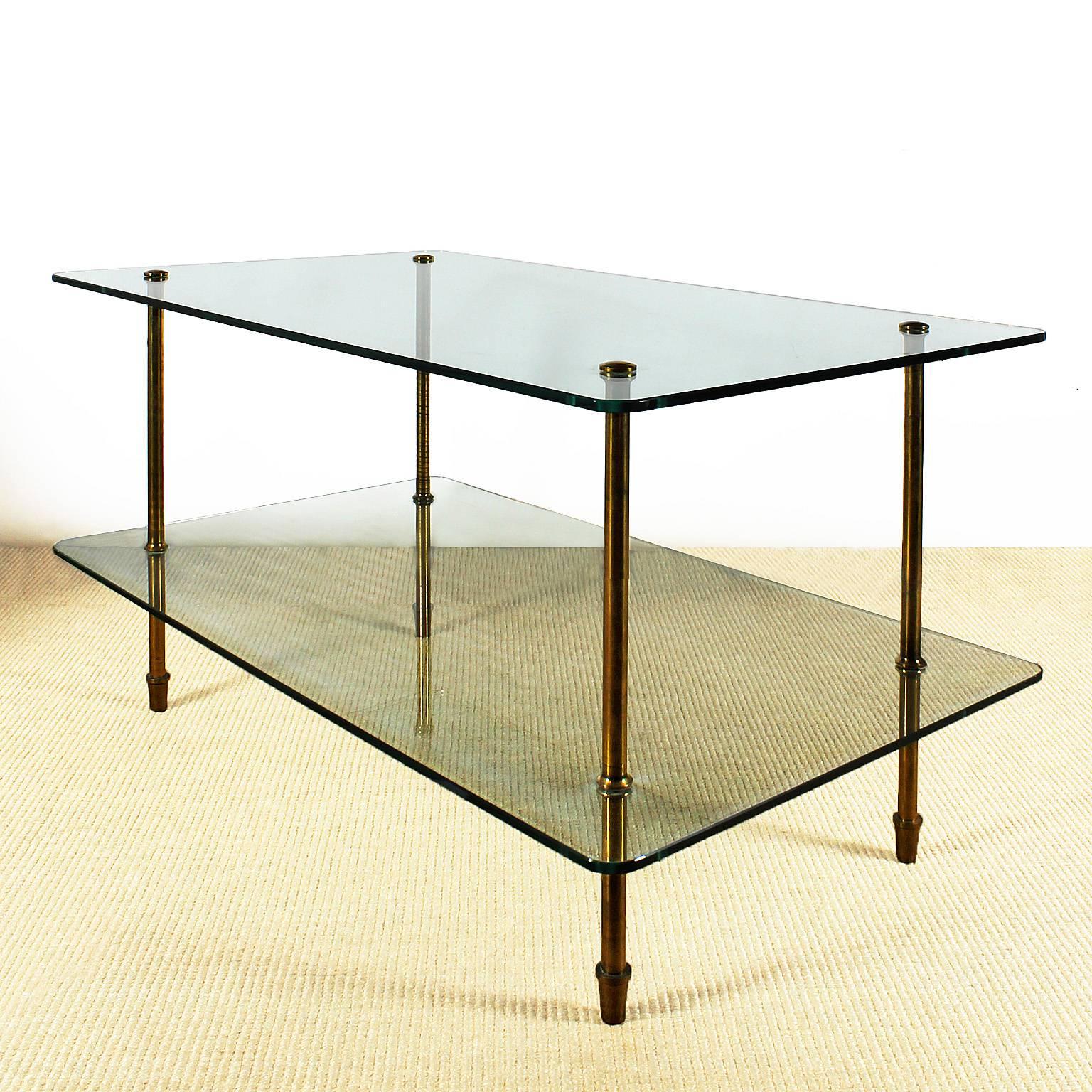 Side table with two thick glass levels, polished solid brass legs, can be completely dismantled. (Possibility of changing the glass measurements),

Italy, circa 1960.