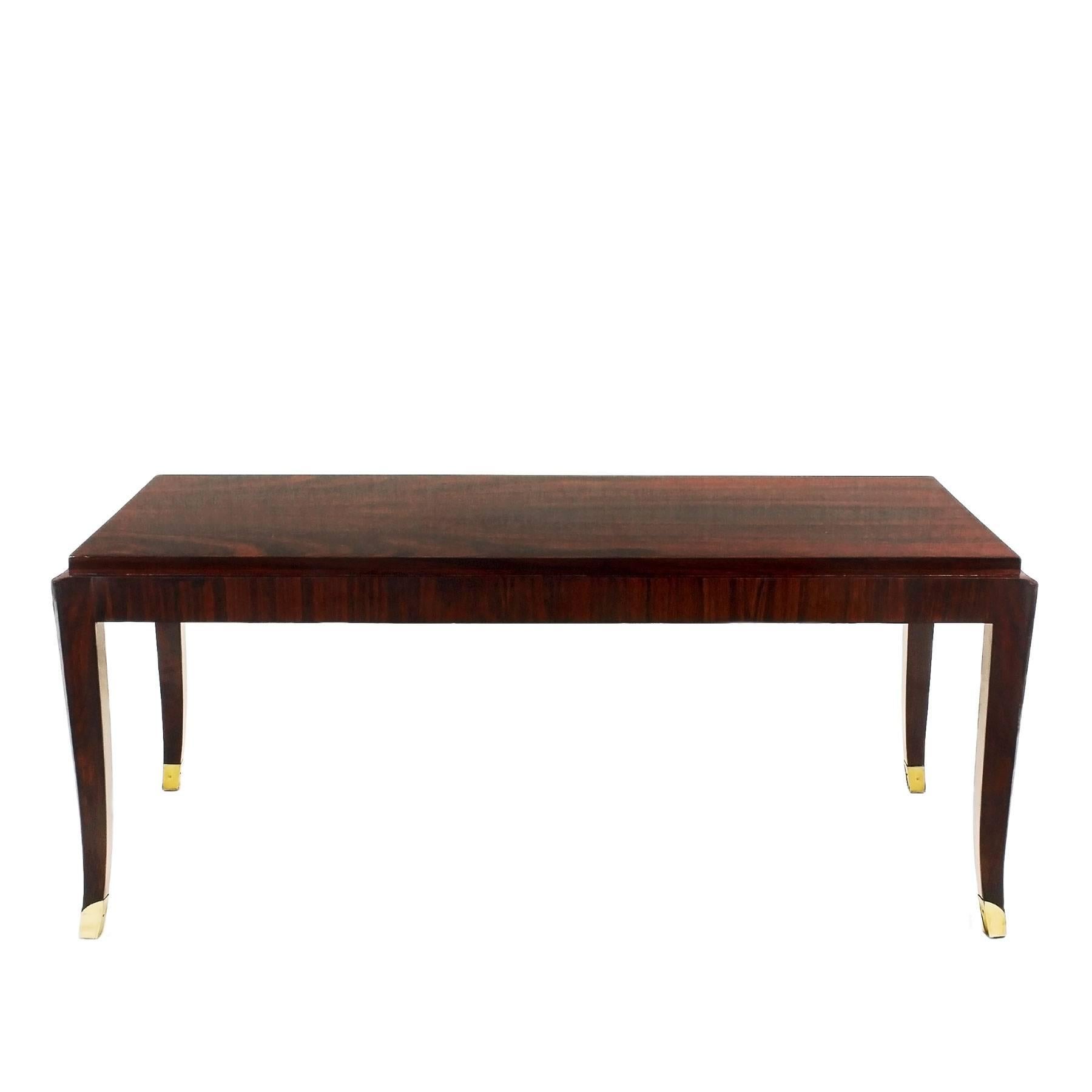 Splendide coffee table, solid mahogany and Rio rosewood veneer, French polish. Polished brass feet.
Maker: De Coene Frères

Belgium, Courtrai circa 1940.