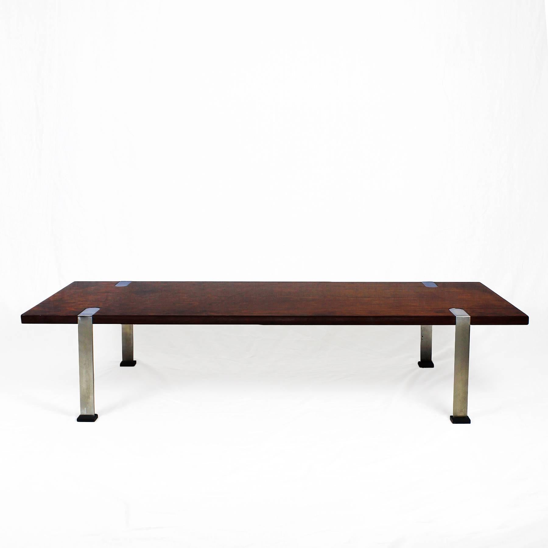 Coffee table, mahogany veneer and nickel plated steel legs with black bases.

Italy, circa 1960.