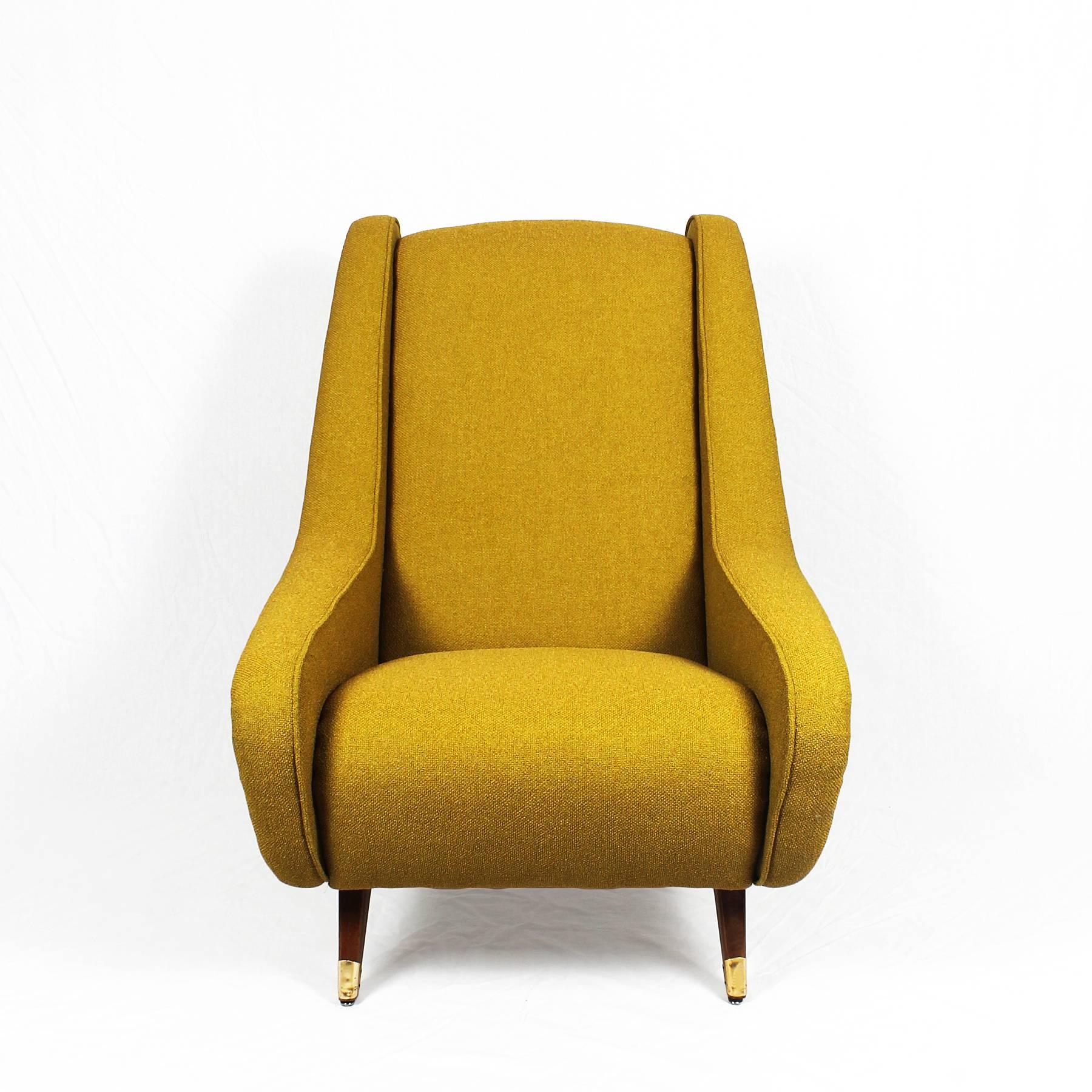 Exceptional pair of armchairs with high backs, completely restored, yellow chenille fabric upholstery. Stained beech feet with small metallic slabs, 

France, circa 1960.
