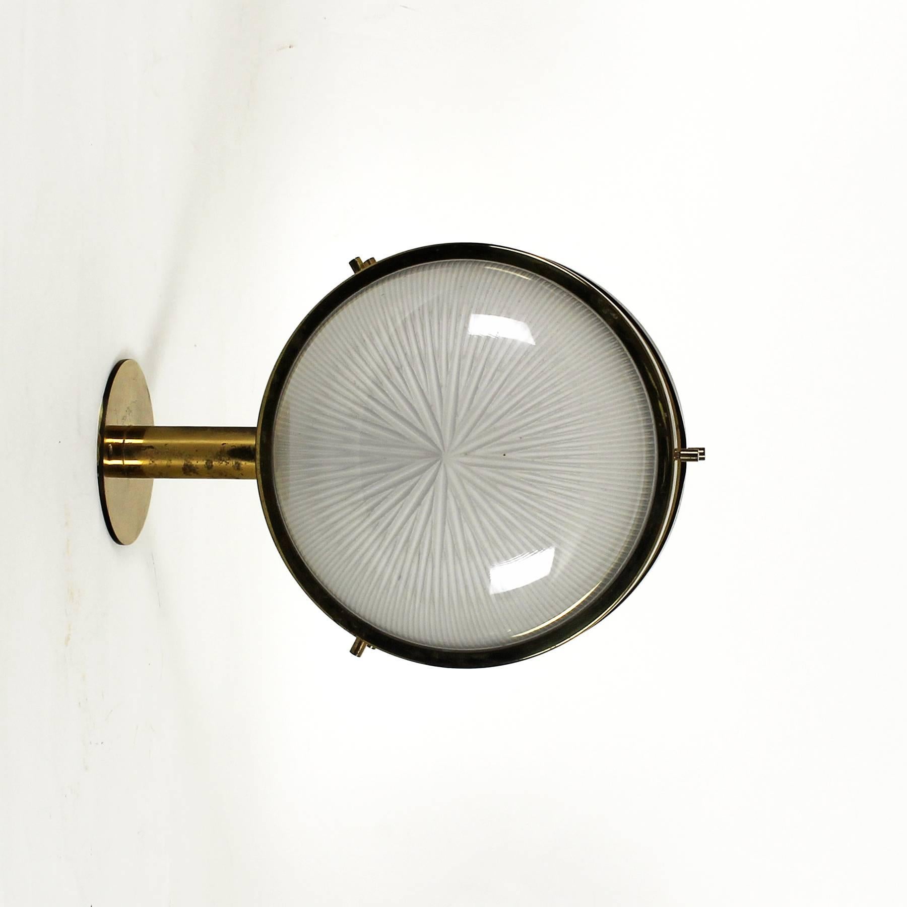 Pair of Sigma wall lights, polished brass and pressed glass.

Design: Sergio Mazza

Manufacturer: Artemide,

Italy, circa 1960.