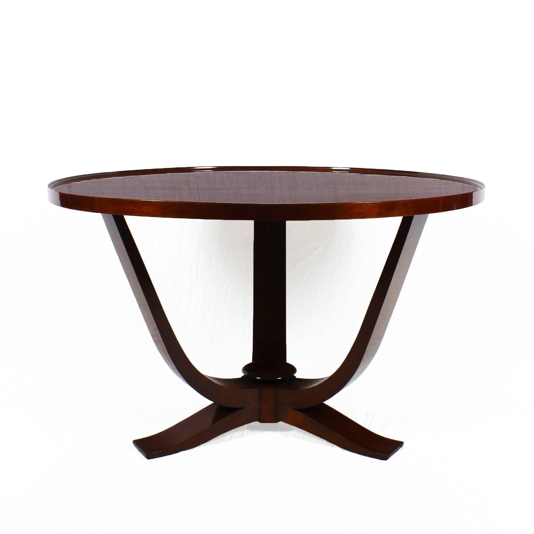 Large Art Deco tripod center table, solid mahogany stand, plywood top with burr mahogany in four parts veneer (ripples on top), French polish.
Attributed to Maison De Coene.

Belgium, circa 1935.