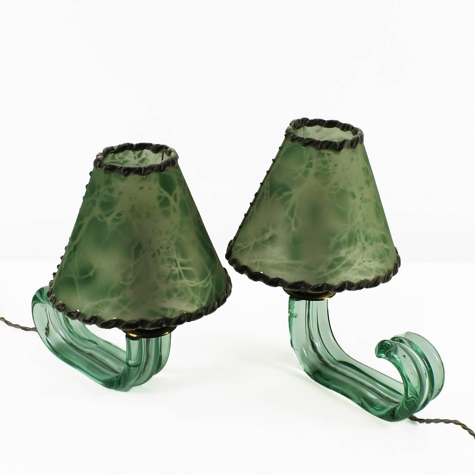 Pair of mini lamps, green Murano glass, brass hardware, original celluloid lampshades.
Brand: Seguso

Italy, Murano, circa 1940.