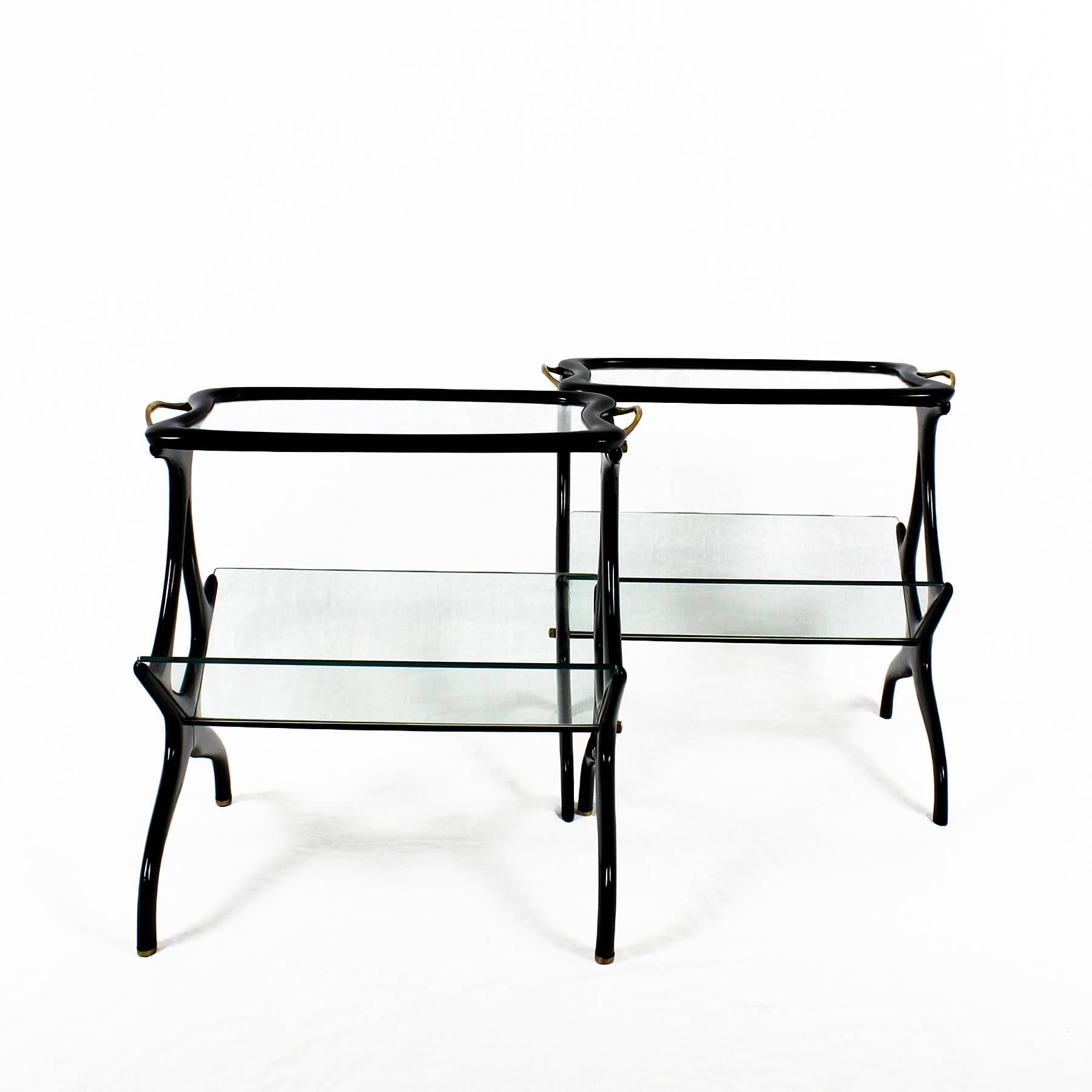 Two rare small tables-magazine rack, stained beech wood, french polish and glass. Brass handles and hardware, polished brass feet (only one of the tables).
Design: Cesare Lacca,

Italy, circa 1950

Unite price.