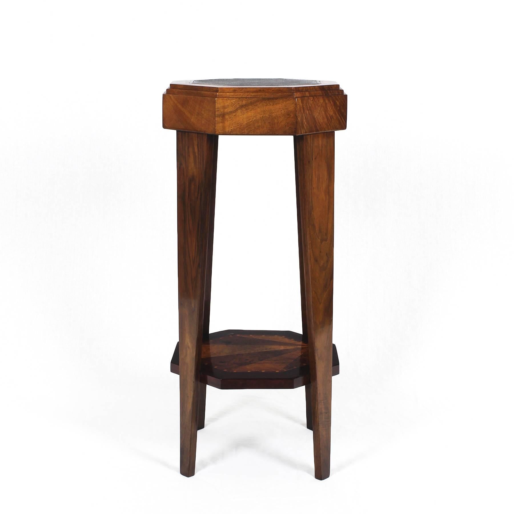 Ravishing Art Deco stand, solid walnut and lemon tree wood, mahogany, rosewood and bird’s-eye maple marquetry, French polish. Original leather on top,

France, 1925.