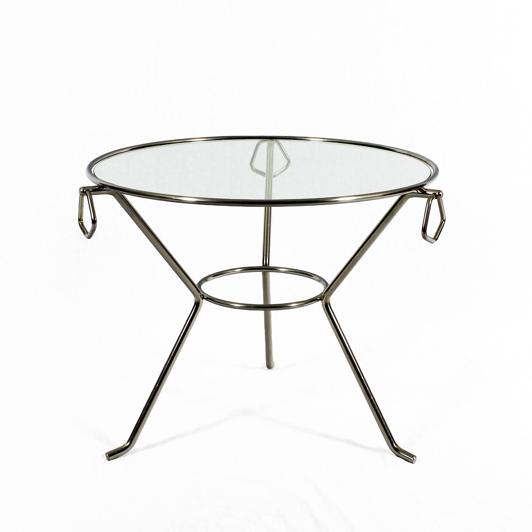 Nice small tripod table, nickel plated brass structure and glass, three decorative rings inserted at the top of stands.

France c. 1950 