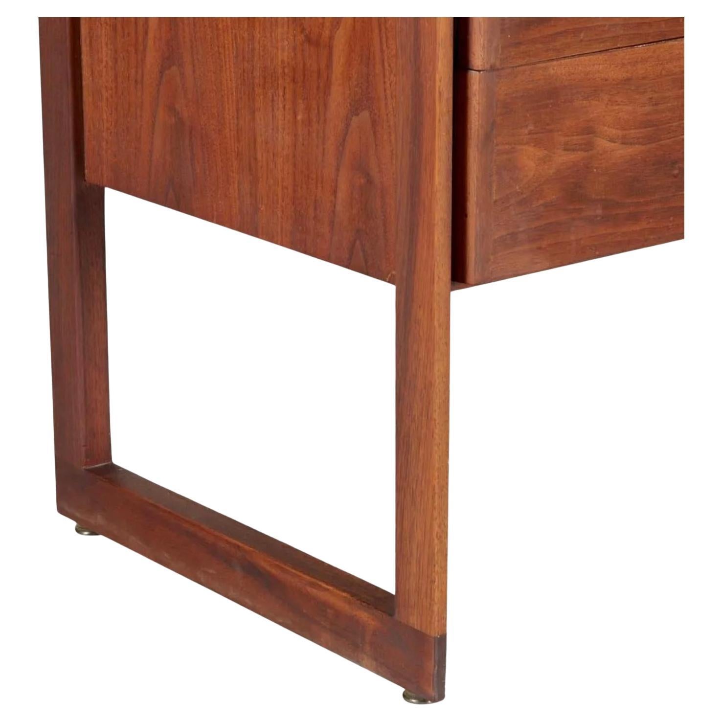 Beautiful American Modern Mid-Century Modern long black walnut 8-drawer dresser credenza with all solid Brass curved pull handles. High end Construction with Metal Drawer slides. Great design good vintage condition with stunning walnut grain. Rare