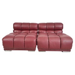 Pair low deep red leather slipper puffy lounge chair without arms Made in Italy