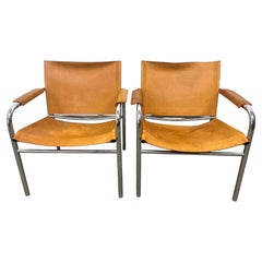 Pair of Tan Leather Klinte sling lounge chairs by Tord Bjorklund Sweden
