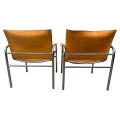 Pair of Tan Leather Klinte sling lounge chairs by Tord Bjorklund Sweden