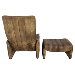 Poltrona vintage De Sede DS 50 in pelle di bufalo marrone con rivestimento patchwork e poggiapiedi