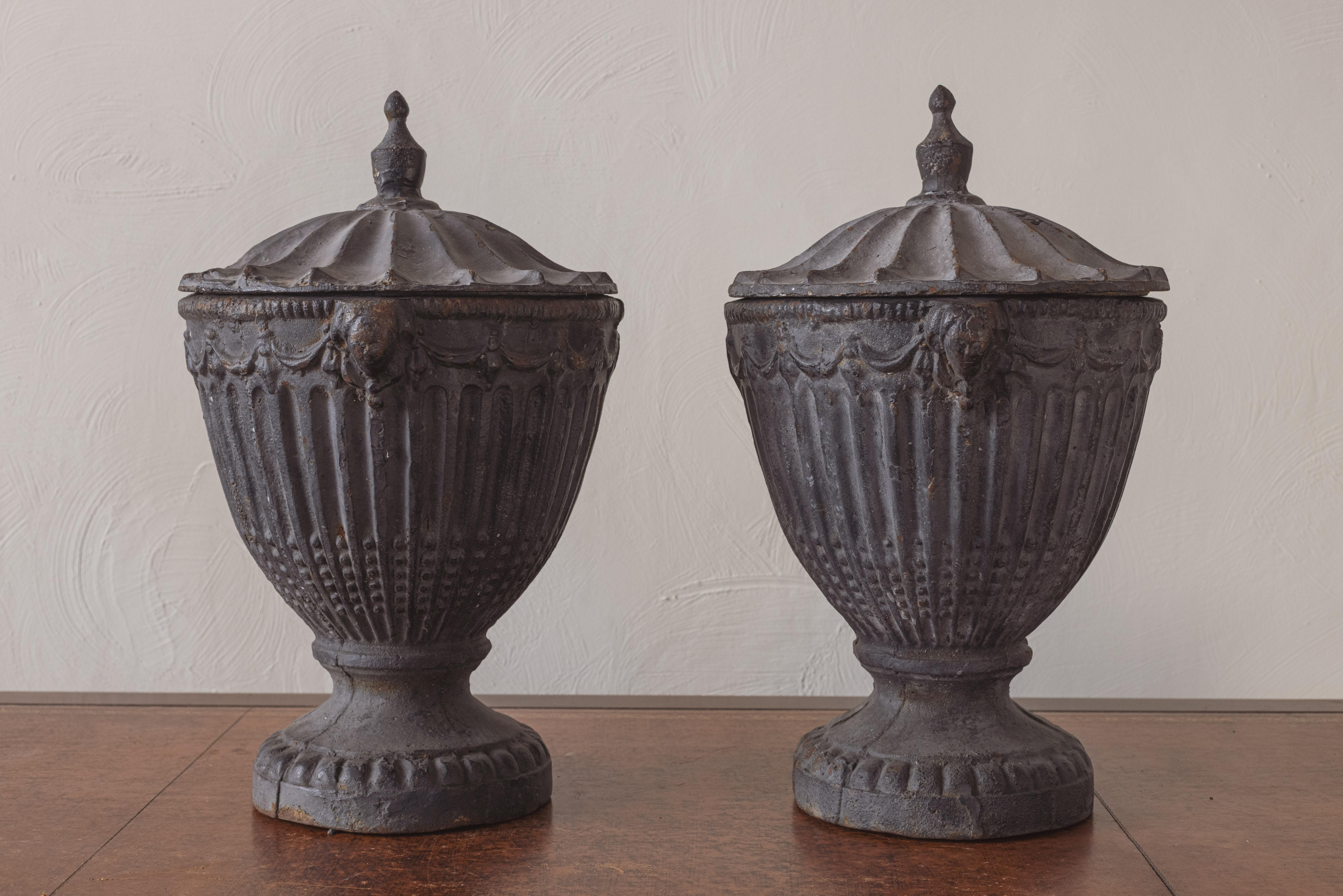 Early 20th Century A Pair of Cast Iron Urns For Sale
