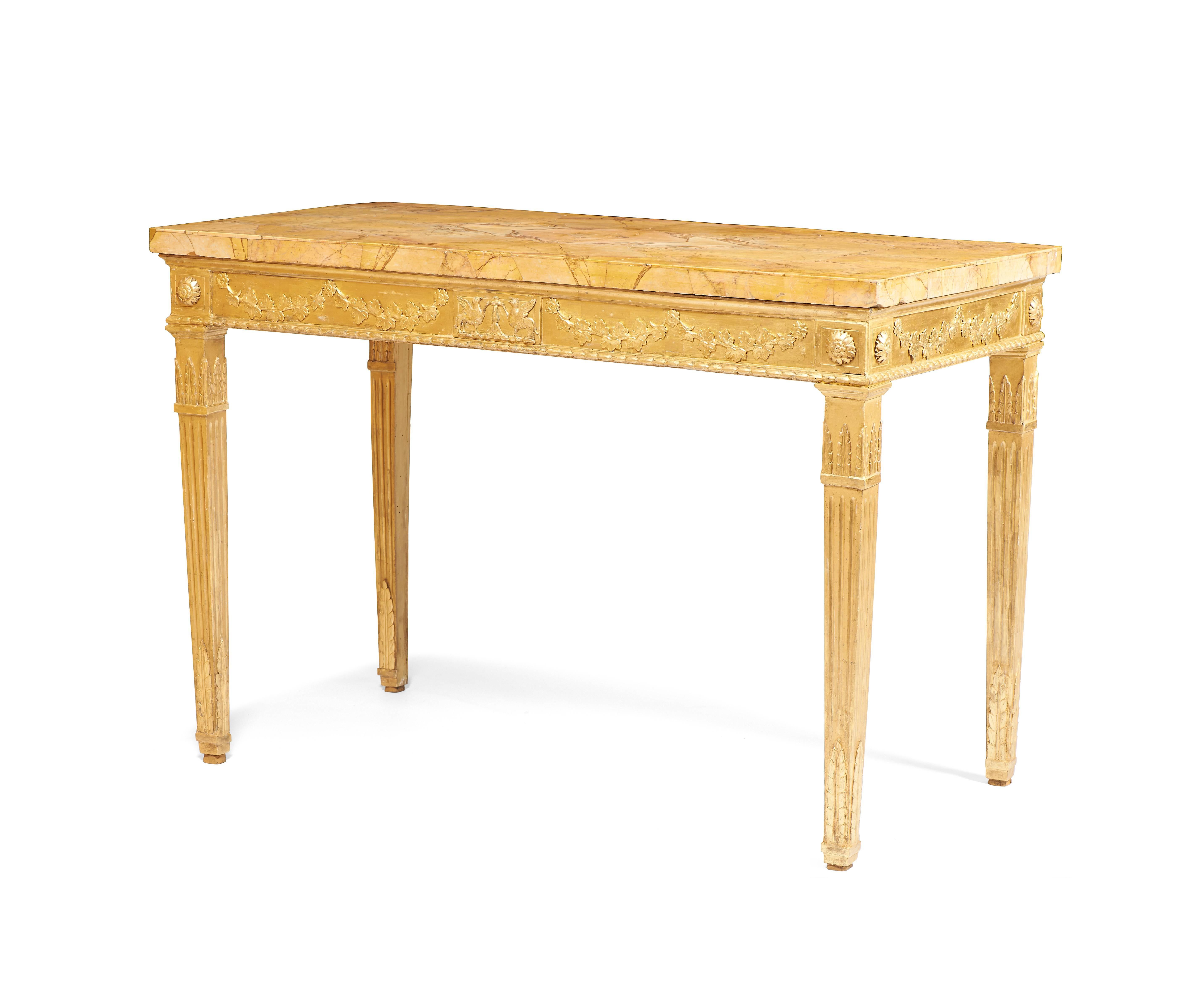 Pair of Roman giltwood console tables decorated with neoclassical and floral motifs. Louis XVI period. Marble top is from the period.