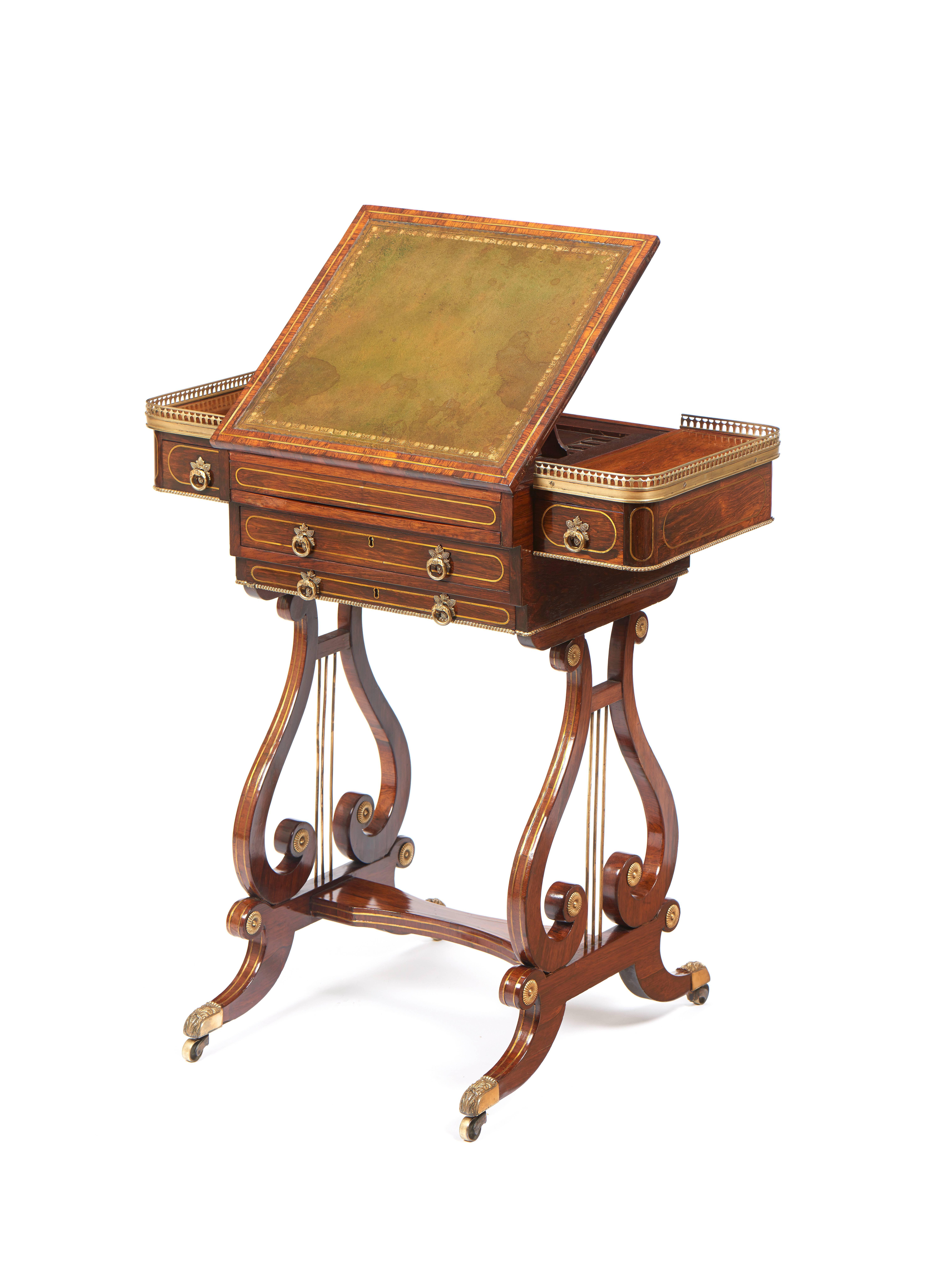 For sale on 1stdibs a Regency brass-mounted and inlaid rosewood writing and games table. The shaped rectangular top with a ratcheted sliding central panel inset with gilt-tooled green leather enclosing a well for backgammon, above a pull-out chess