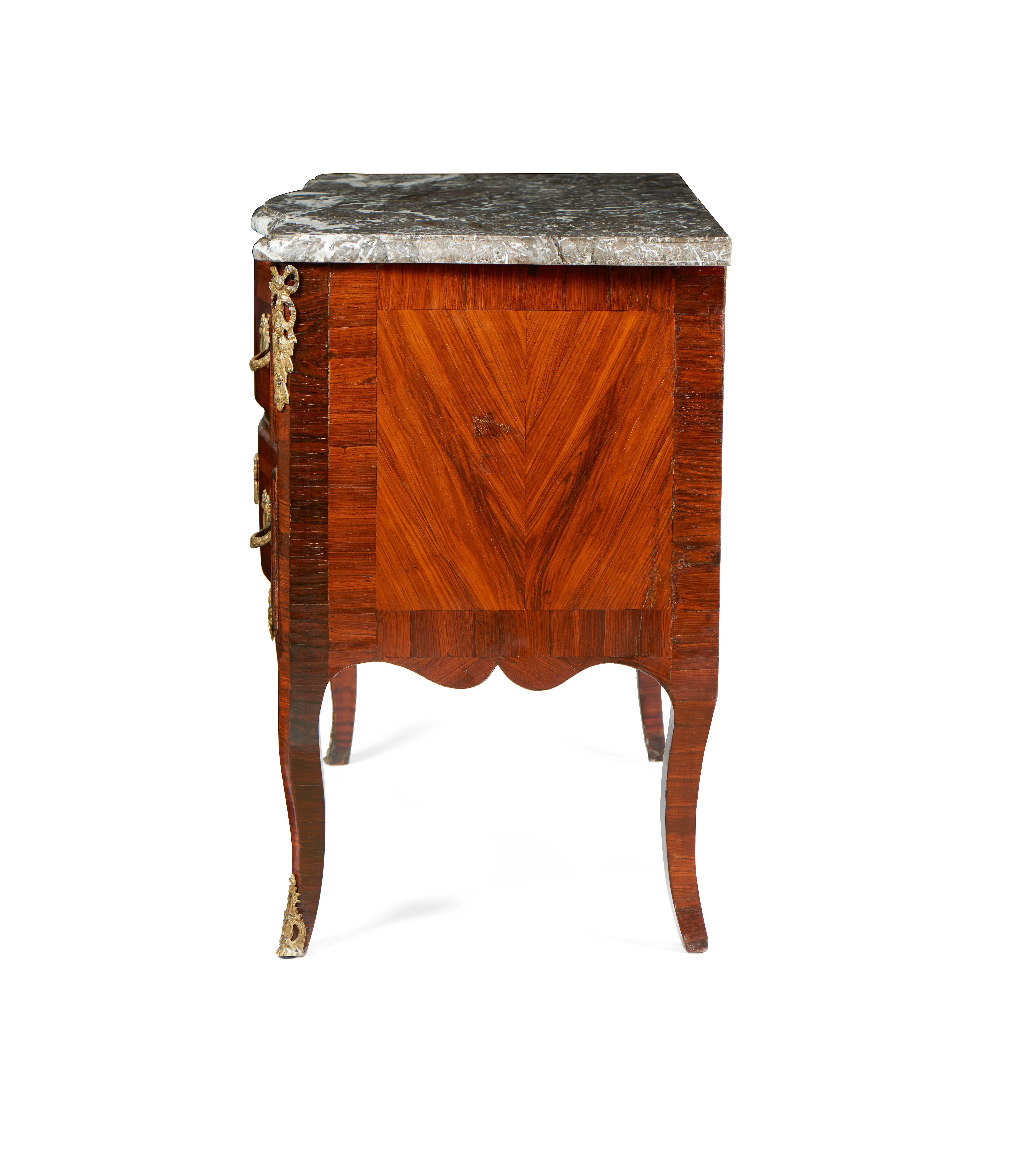 For sale on 1stdibs a fine rosewood Louis XV transition Louis XVI bronze-mounted chest of drawers with marble top. With two sided drawers and one long drawer this commode has a grey marble top, a fine quality veneered rosewood and all the bronzes