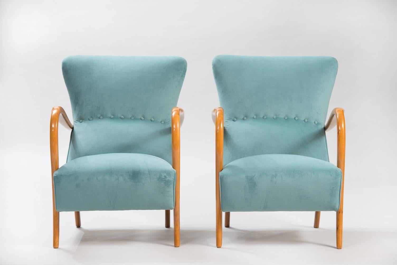 Pair of armchairs, re-upholstered in blue velvet.