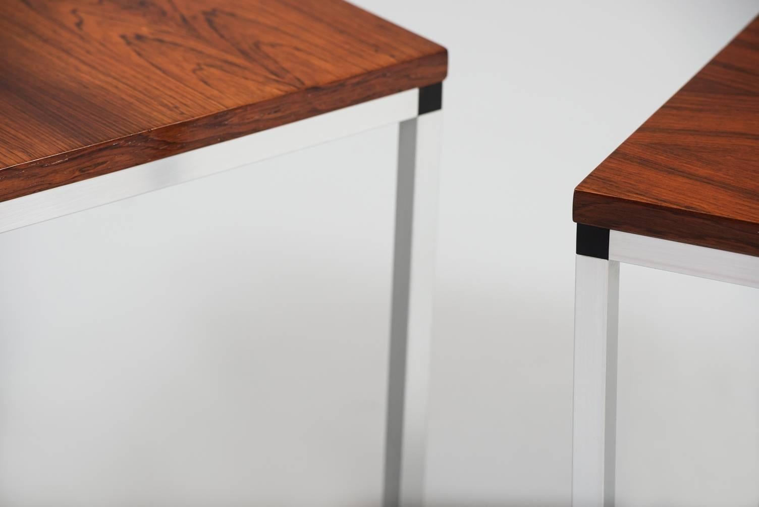 Rosewood and chrome side tables, one pair, can be sold separately.