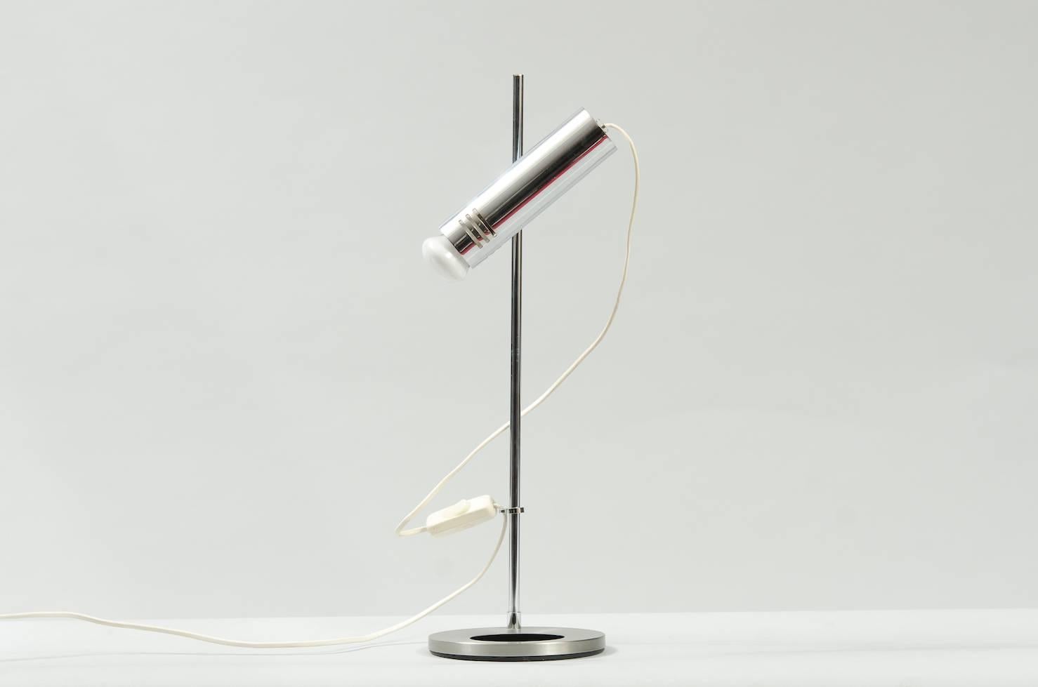 Adjustable chrome desk lamp.