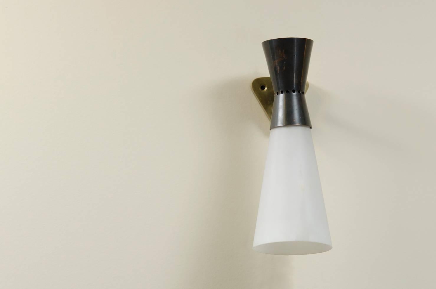 Brass and frosted glass diablo wall sconce.