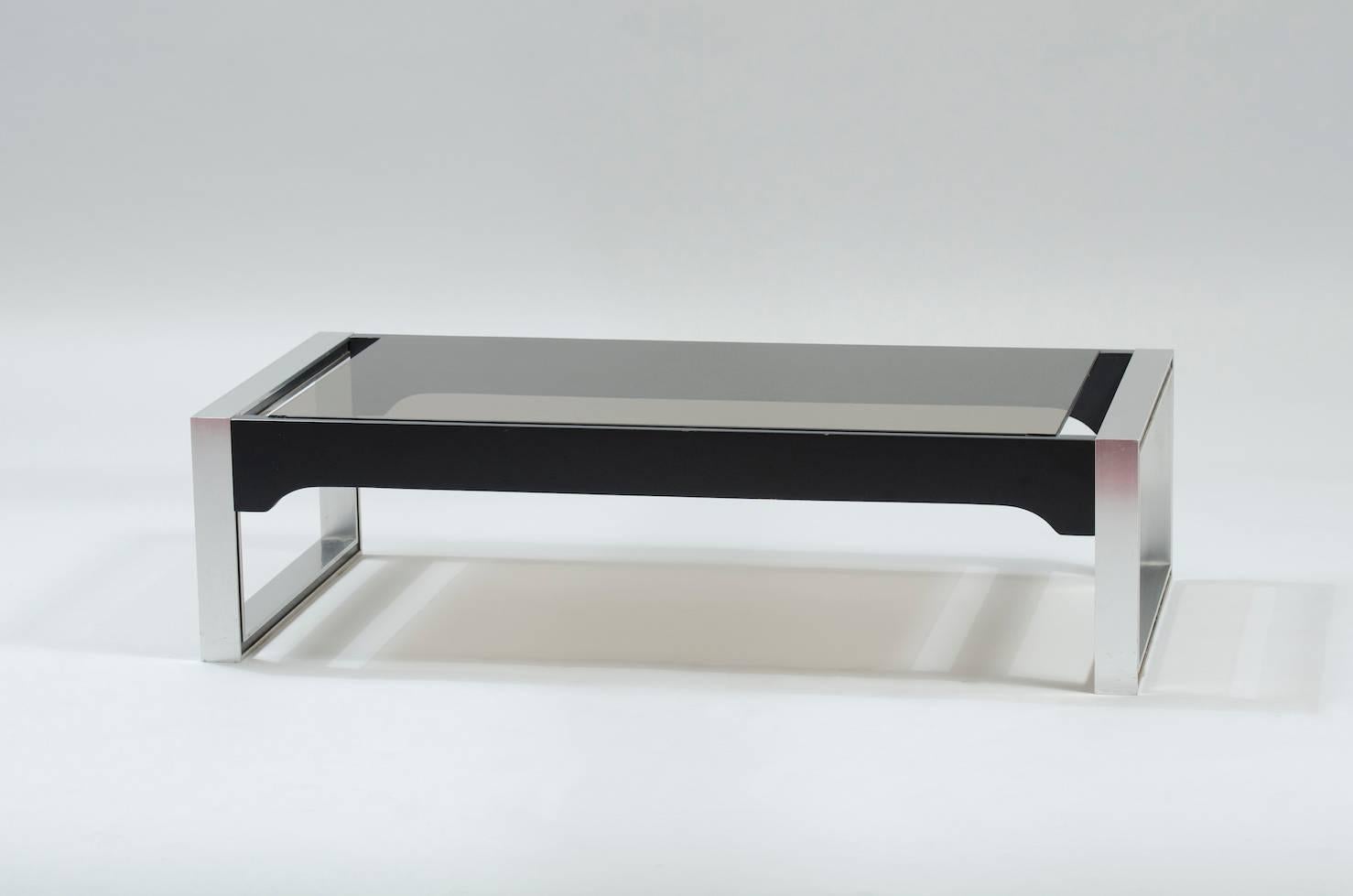 Black lacquered wood, aluminium and grey smoked glass coffee table.
Producer: Ligne Roset.