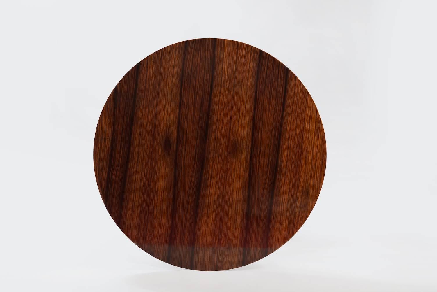 Rosewood and anodized aluminium round dining table.