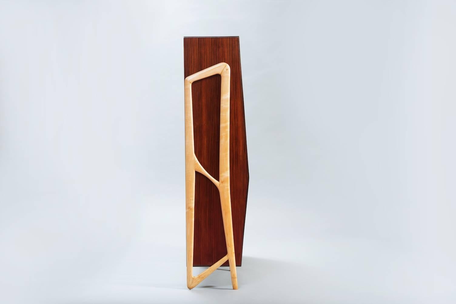 Rosewood and sycamore bookcase with glass sliding doors and two drawers.
Producer: Fratelli Civati.