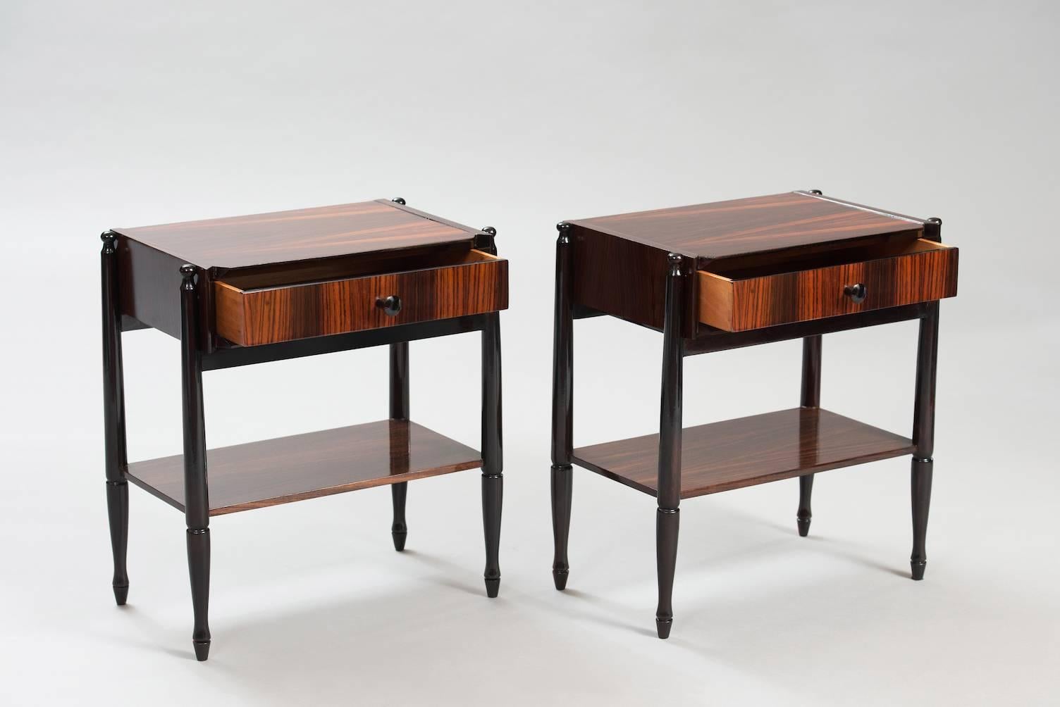 A pair of rosewood nightstands.