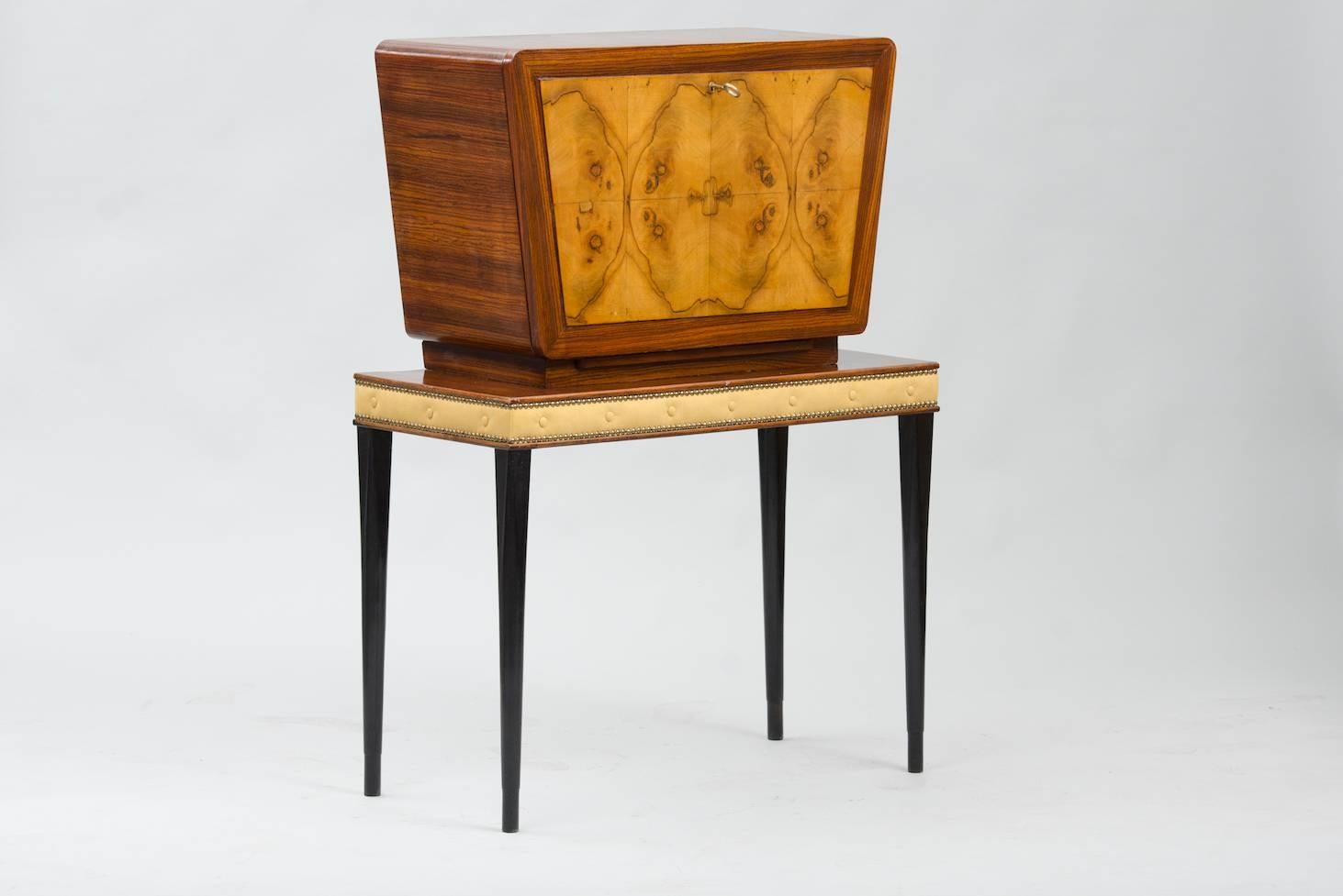 Rosewood, olive wood root and fabric cocktail cabinet.
Interior with mirror patchwork, glass self and lighting.
Price fully restored: 2750€
The price shown is in the original condition.
We have our own workshop and we can restore these items,
