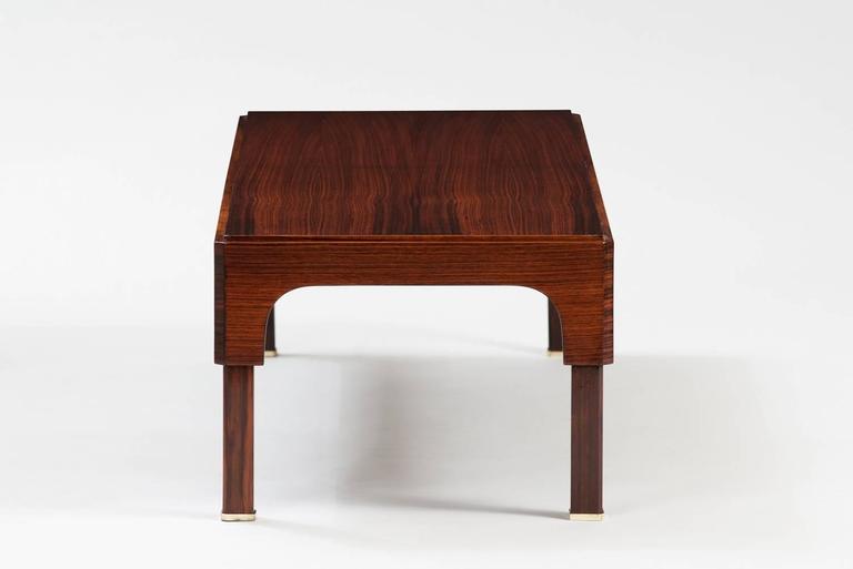 Rosewood and brass coffee table.
Producer: Elam.