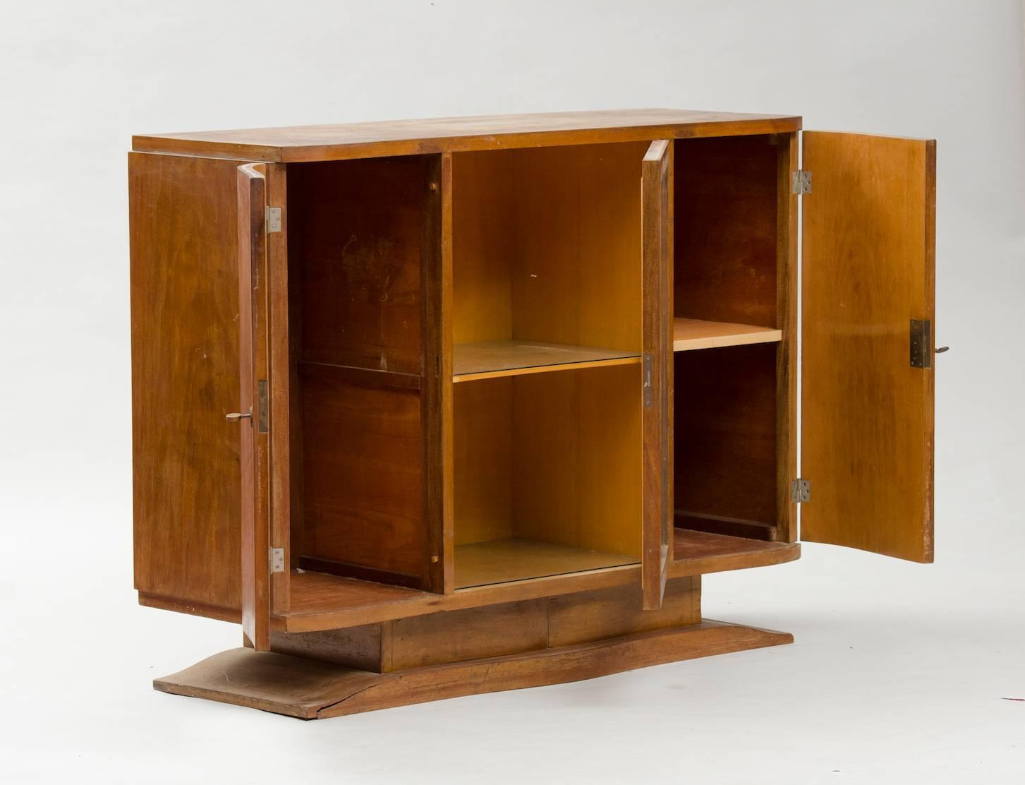 Small Art Deco walnut sideboard with central display area.
Price fully restored: 2775€
The price shown is in the original condition.
We have our own workshop and we can restore these items, including upholstery and all the piece might need.