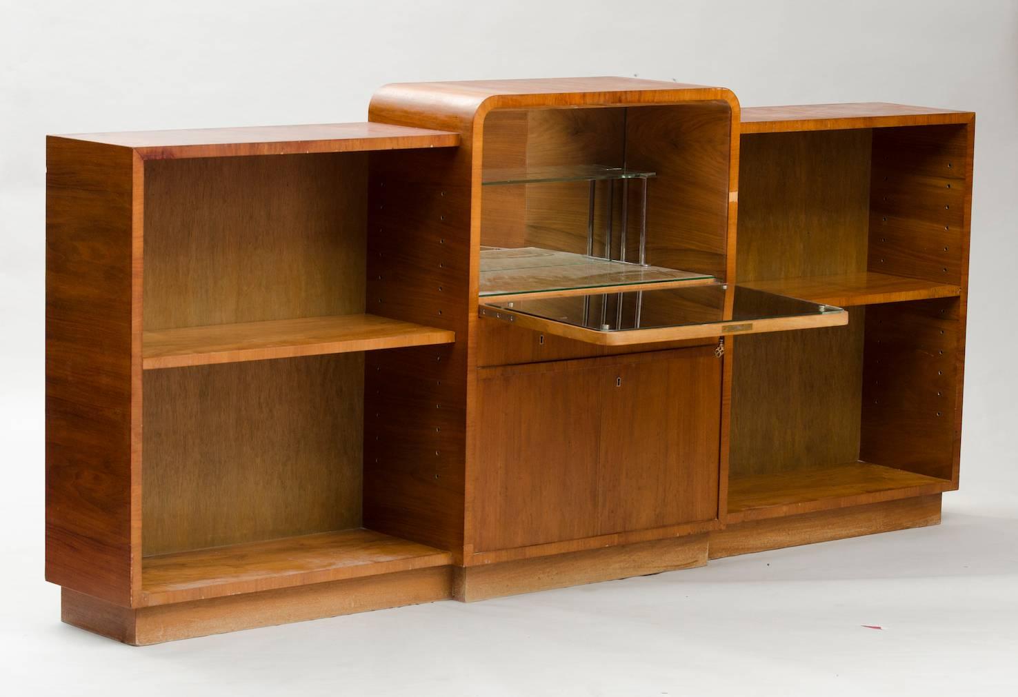 Walnut bookshelf with a central dry bar, inlaid figures in the door.
Price fully restored: 2775€
Producer: Garsnas Mobler
The price shown is in the original condition.
We have our own workshop and we can restore these items, including upholstery