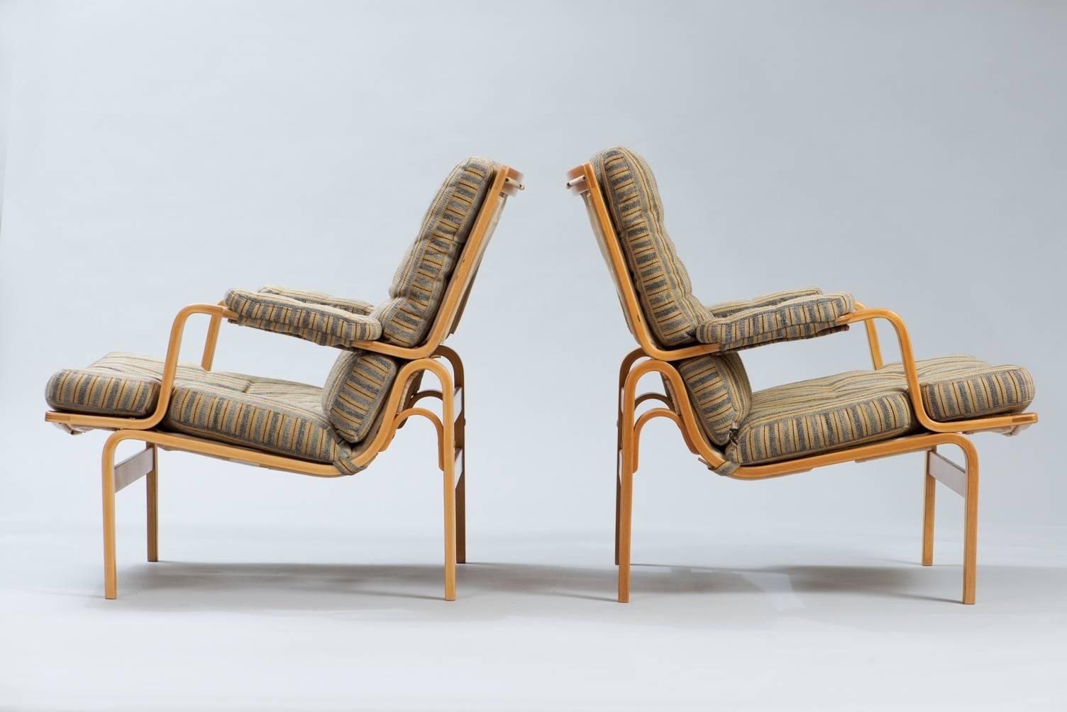 Pair of  ”Ingrid” lounge chairs in bent beech wood and original wooll fabric upholstery.
Producer: Dux