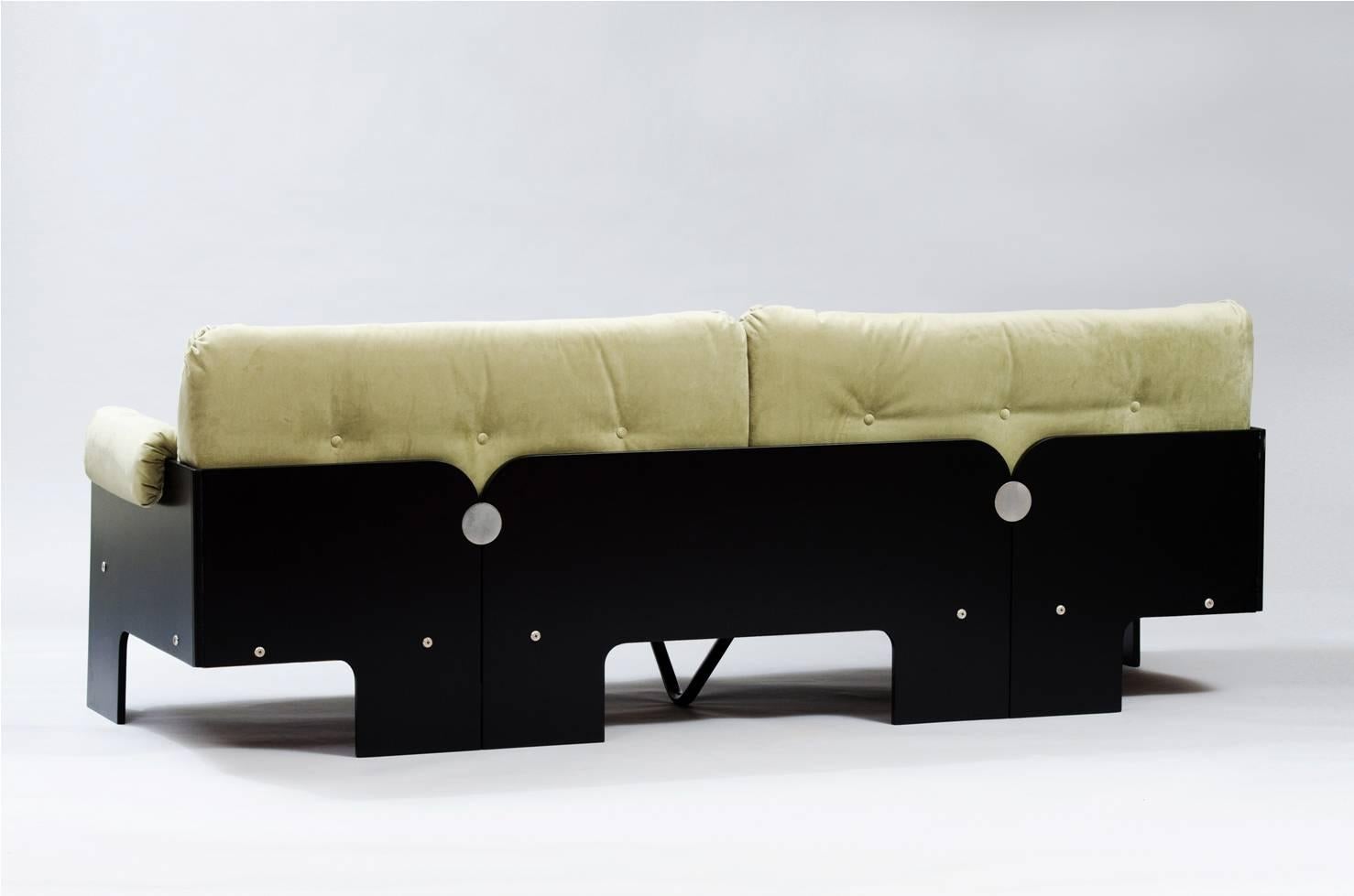Three-seat sofa in black lacquered wood, upholstered in green velvet, in the style of Claudio Salocchi.