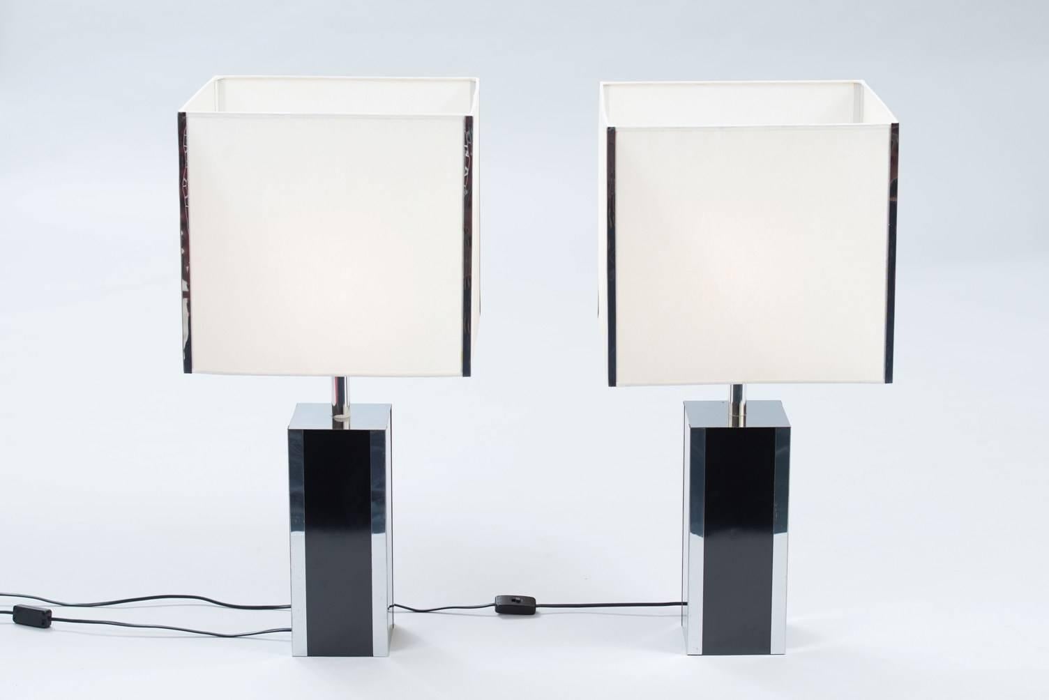 Black formica and chrome pair of large table lamps.