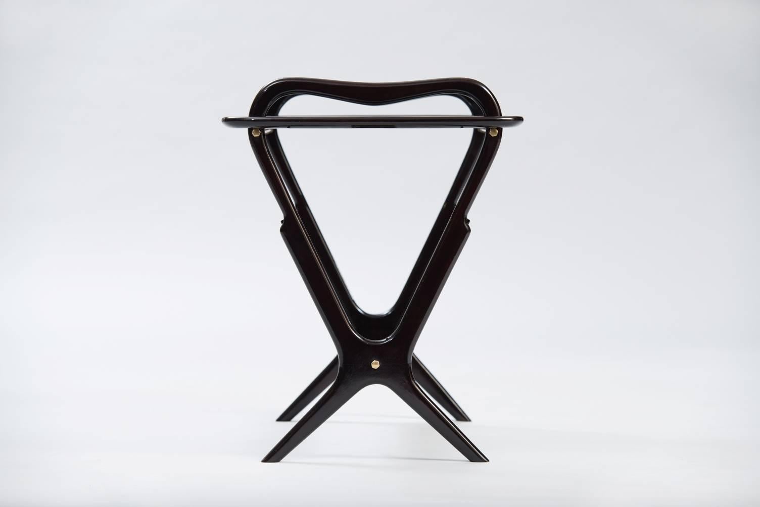 Ebonized wood and glass side table with magazines rack, the top is a removable tray.
Producer: de Baggis