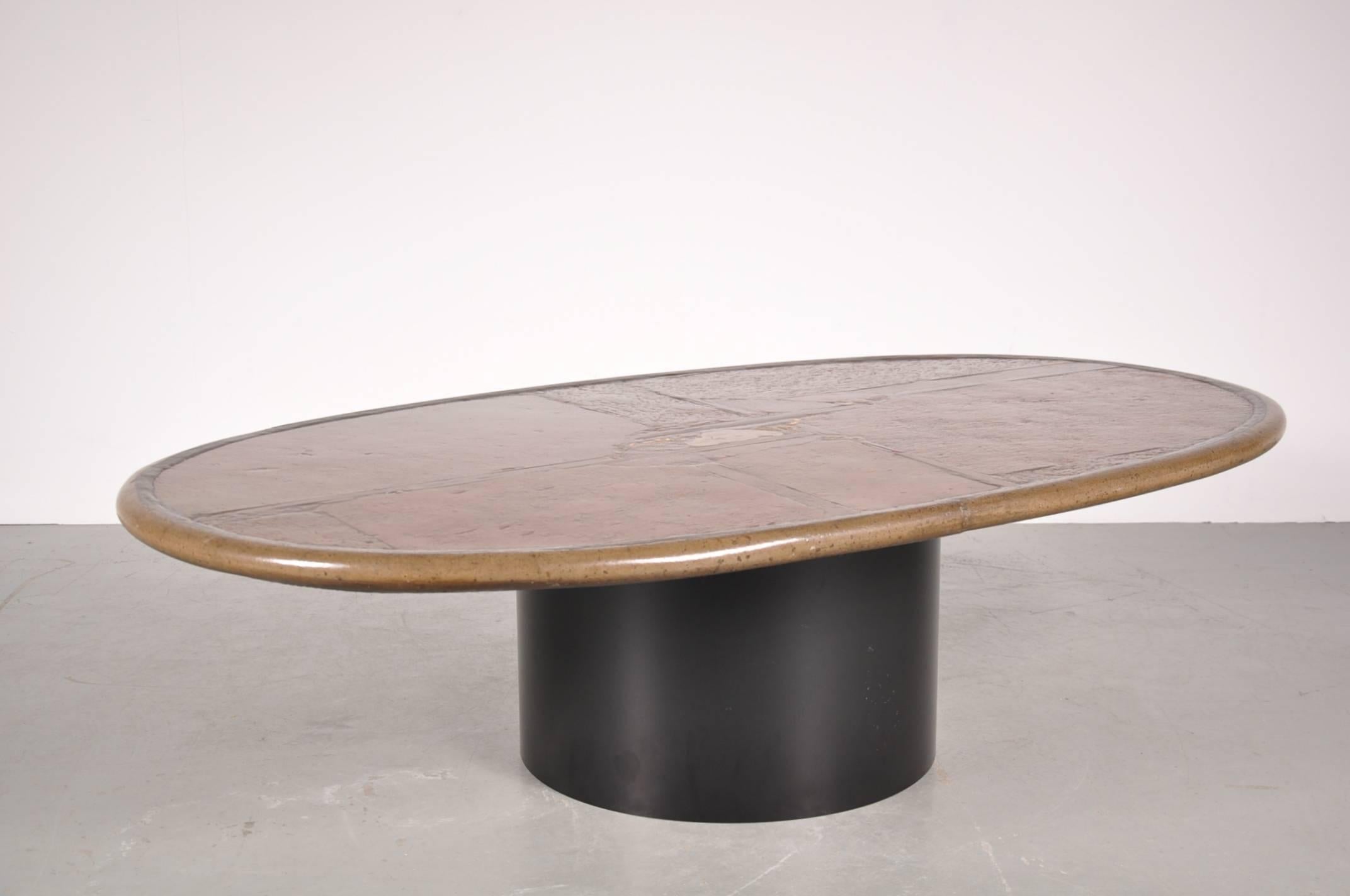 Unique coffee table designed by Paul Kingma, manufactured in the Netherlands in 1993.

This beautiful ‘one of a kind’ table is made of high quality stone on a metal base. It is signed P. Kingma '93. The top is enriched with different materials