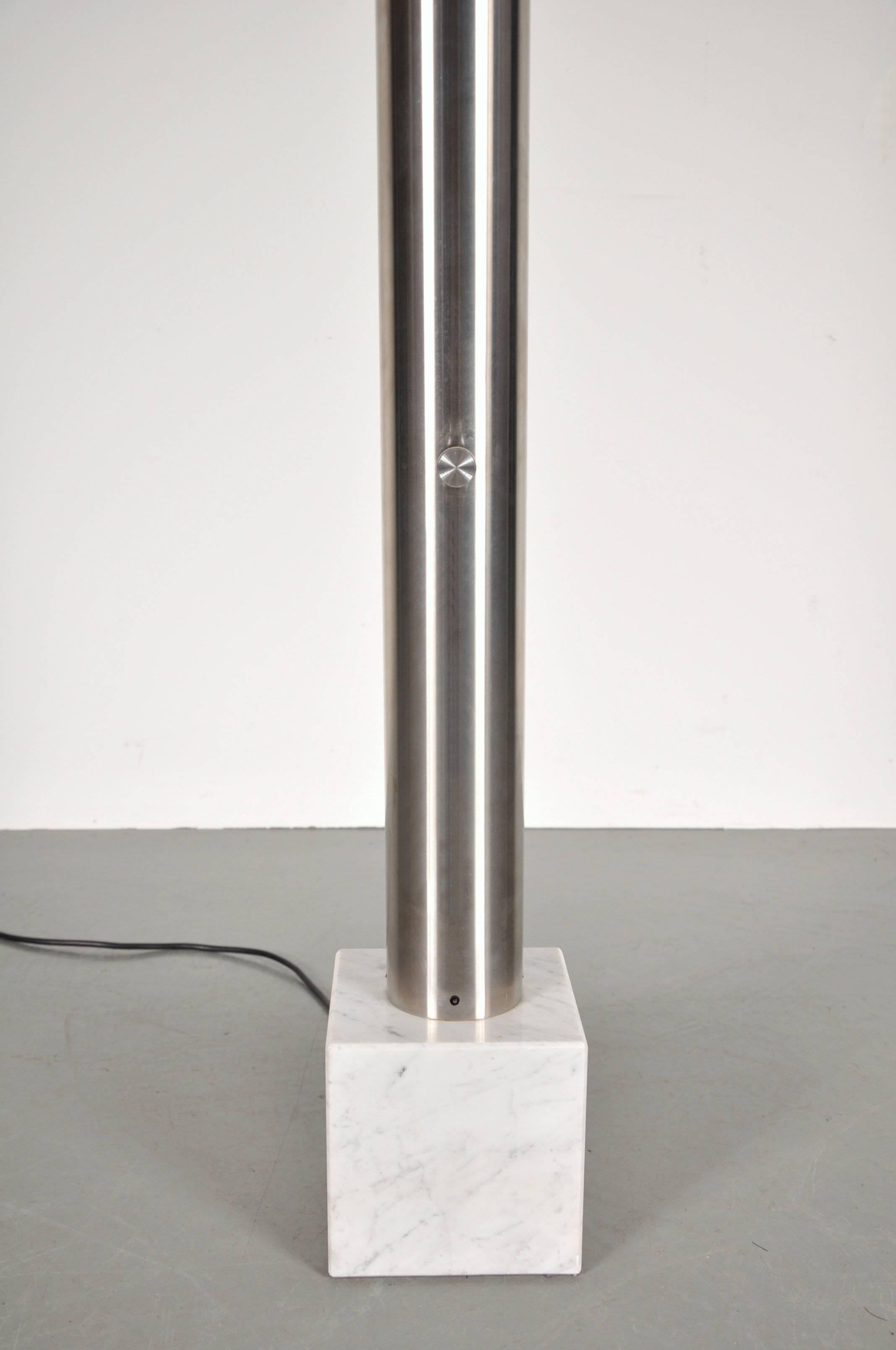 Stunning Italian floor lamp manufactured, circa 1960.

This unique piece is made of high quality aluminium on a beautiful marble base, ginving it a luxury appearance. Emitting light from the top, the lamp is a true eye-catcher that would make a