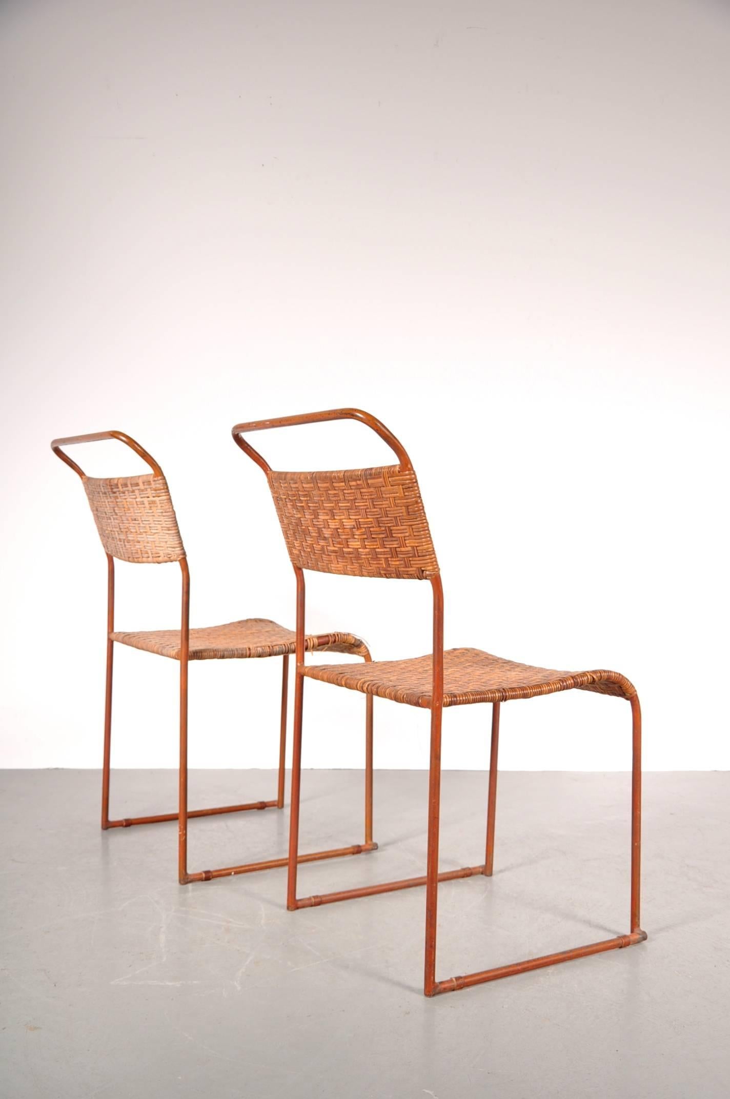 Amazing set of two rare Bauhaus prototype dining chairs, manufactured around 1930.

These beautifully crafted chairs have a metal base with woven rattan seats and backrests. One of the chairs is still in good condition, the other chair needs