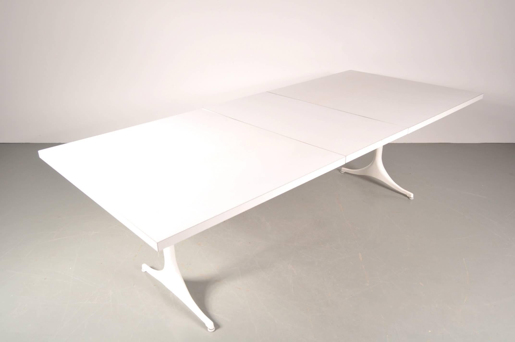 Beautiful dining table designed by George Nelson, manufactured by Herman Miller in the USA, circa 1960.

The table is made of the highest quality white coated aluminium with a well-crafted white laminated wooden top. It has two inlay tops, making