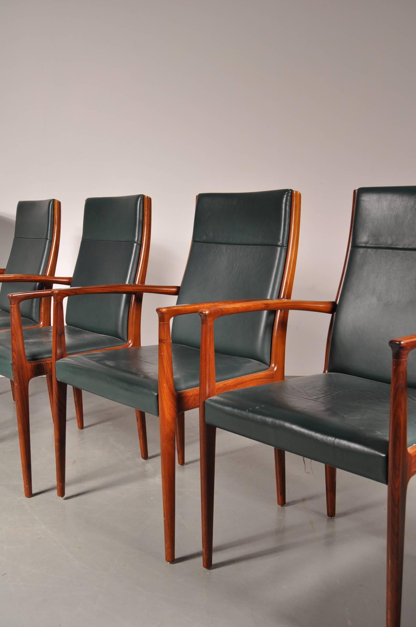 Beautiful set of six conference/dining chairs manufactured by Lübke in Germany around 1960.

These six rare chairs are made of amazing quality rosewood and upholstered in beautiful forest green leather, giving them a very luxurious appearance.