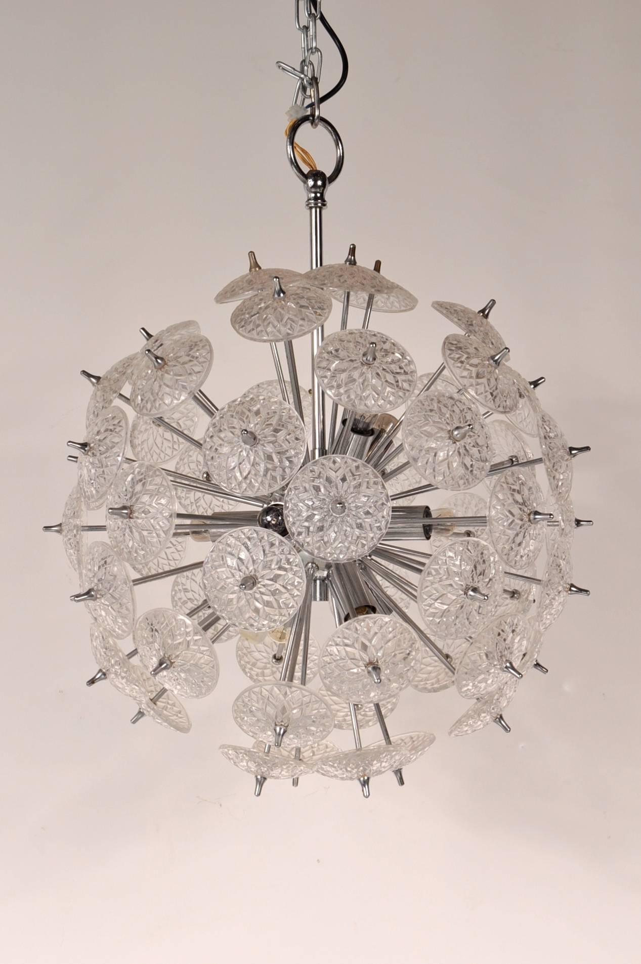 Eye-catching Sputnik chandelier in the style of Emil Stejnar, manufactured in Belgium, circa 1970.

This stunning piece has a high quality chrome metal base with crystal glass flowers on the ends of the many arms. The glass pieces are beautifully