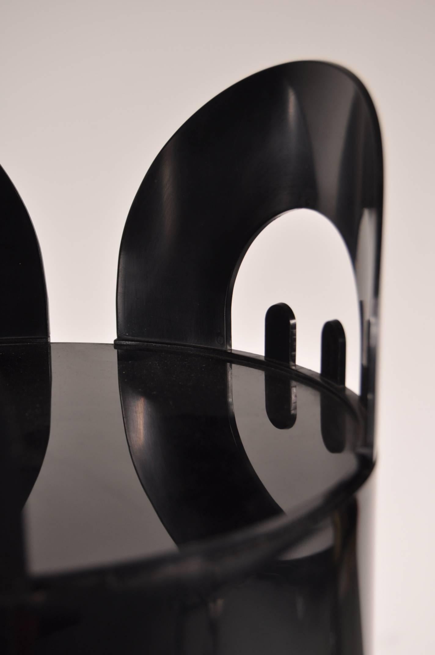 Beautiful coat rack with umbrella stand and storage tray designed by Enzo Mari, manufactured by Danese, Italy in 1968.

This original piece is completely made of black plastic with a strong concrete base, providing extra stability. It is uniquely