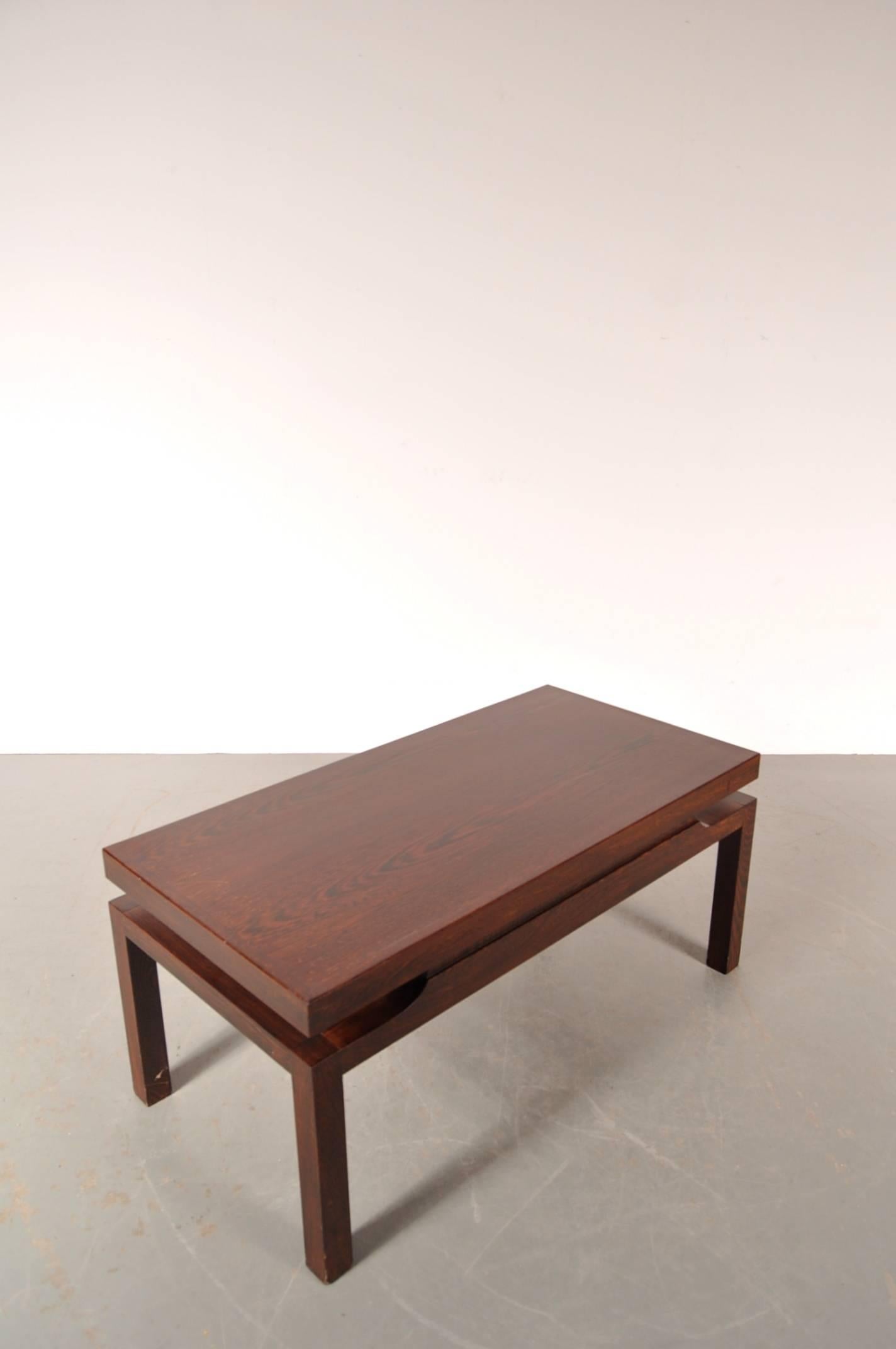 Stunning coffee table designed by Emiel Veranneman in Belgium around 1960.

This beautifully designed piece is completely made of the highest quality wengé wood. It is well crafted with a very nice eye for detail, a unique and eye-catching piece