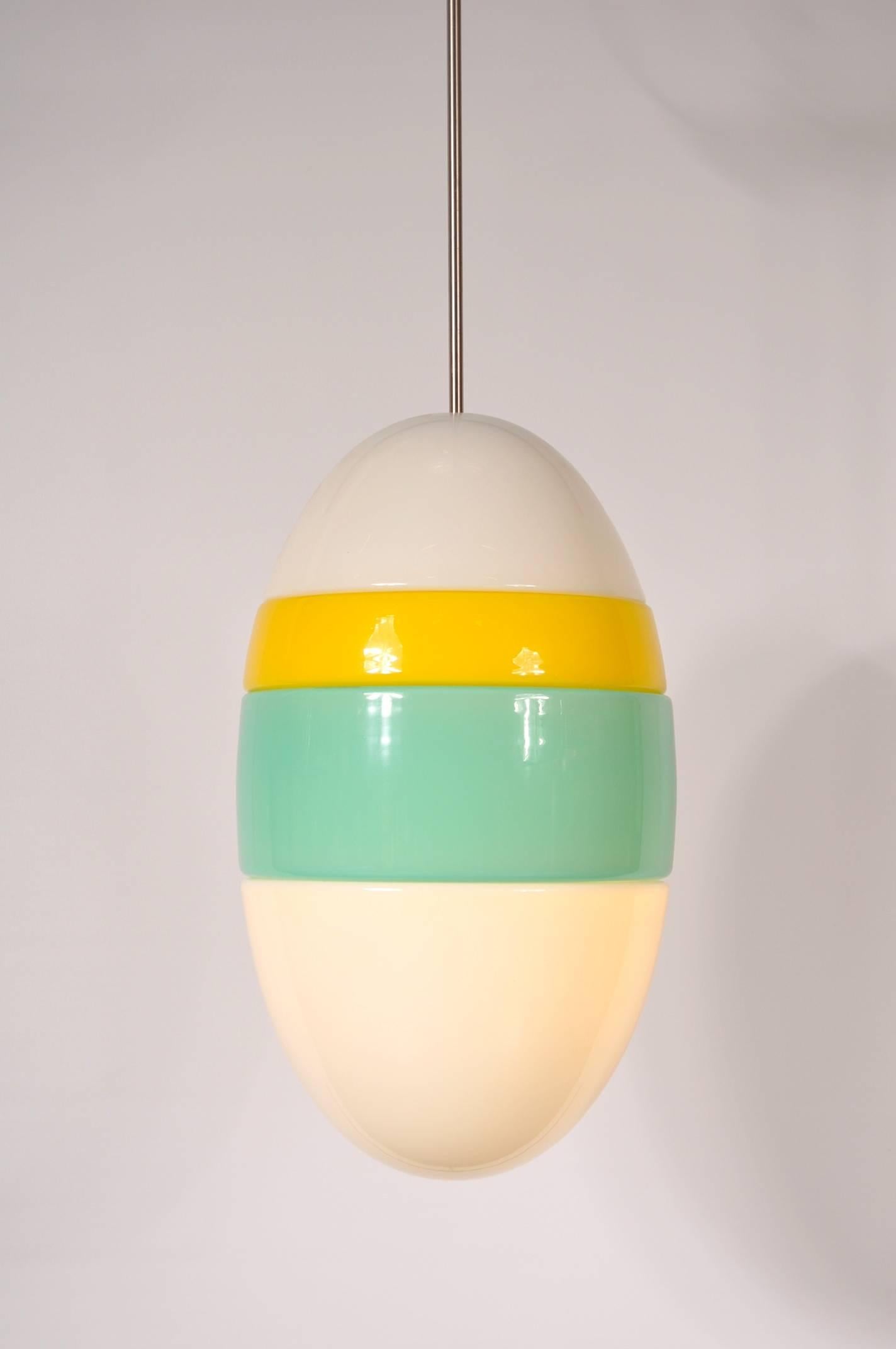 Unique hanging lamp, manufactured by Vistosi in Italy, circa 1960.

This colourful piece is made from beautiful quality Murano glass in white, green en yellow. It has a beautiful chrome metal arm to give it a nice finishing touch. It emits a very