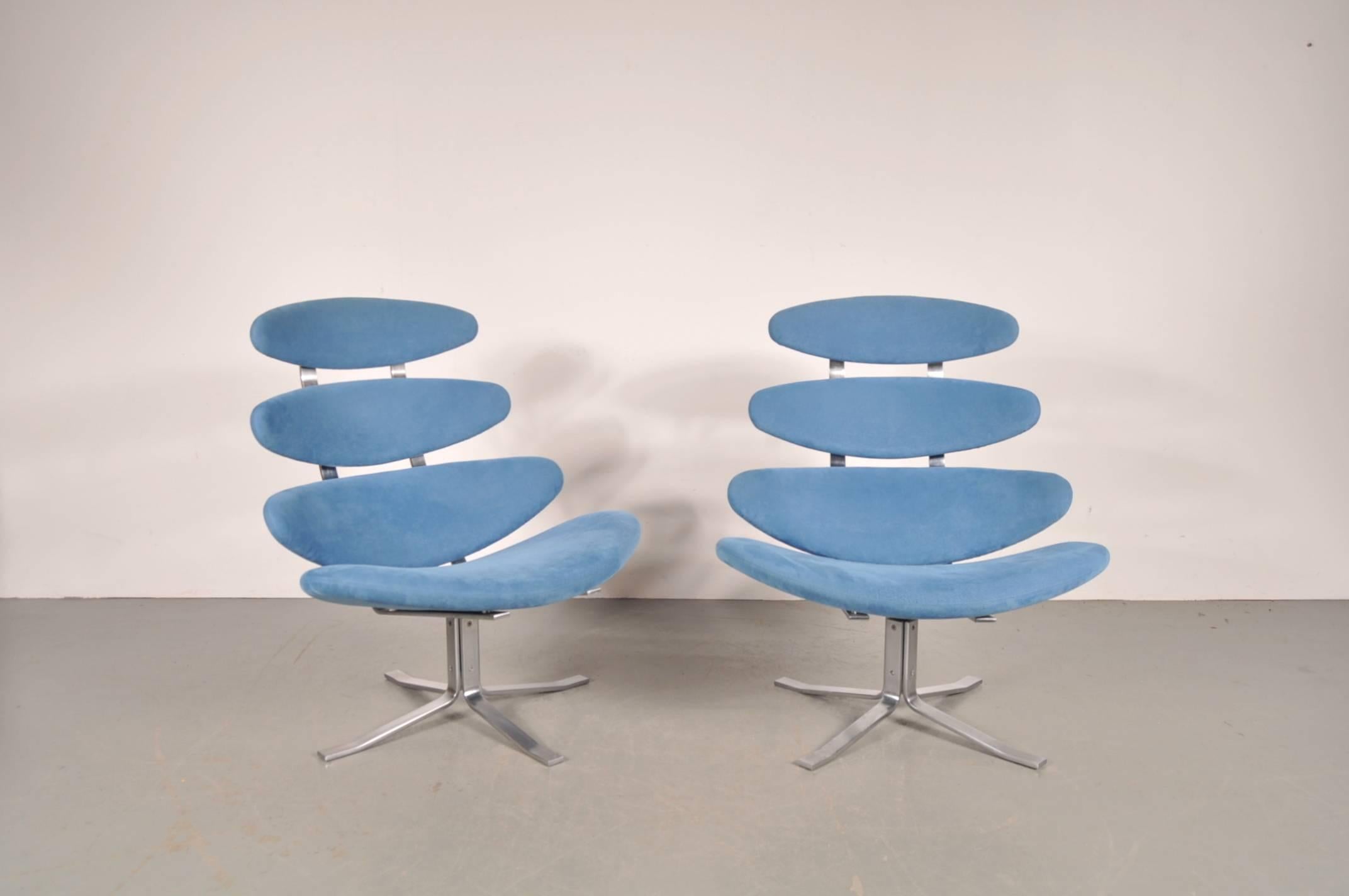 Stunning set of two Corona chairs designed by Poul Volther, manufactured by Erik Jorgensen in Denmark in 1964.

These iconic chairs are made of beautiful quality chrome metal and are newly upholstered in wonderful blue suede. There elliptical